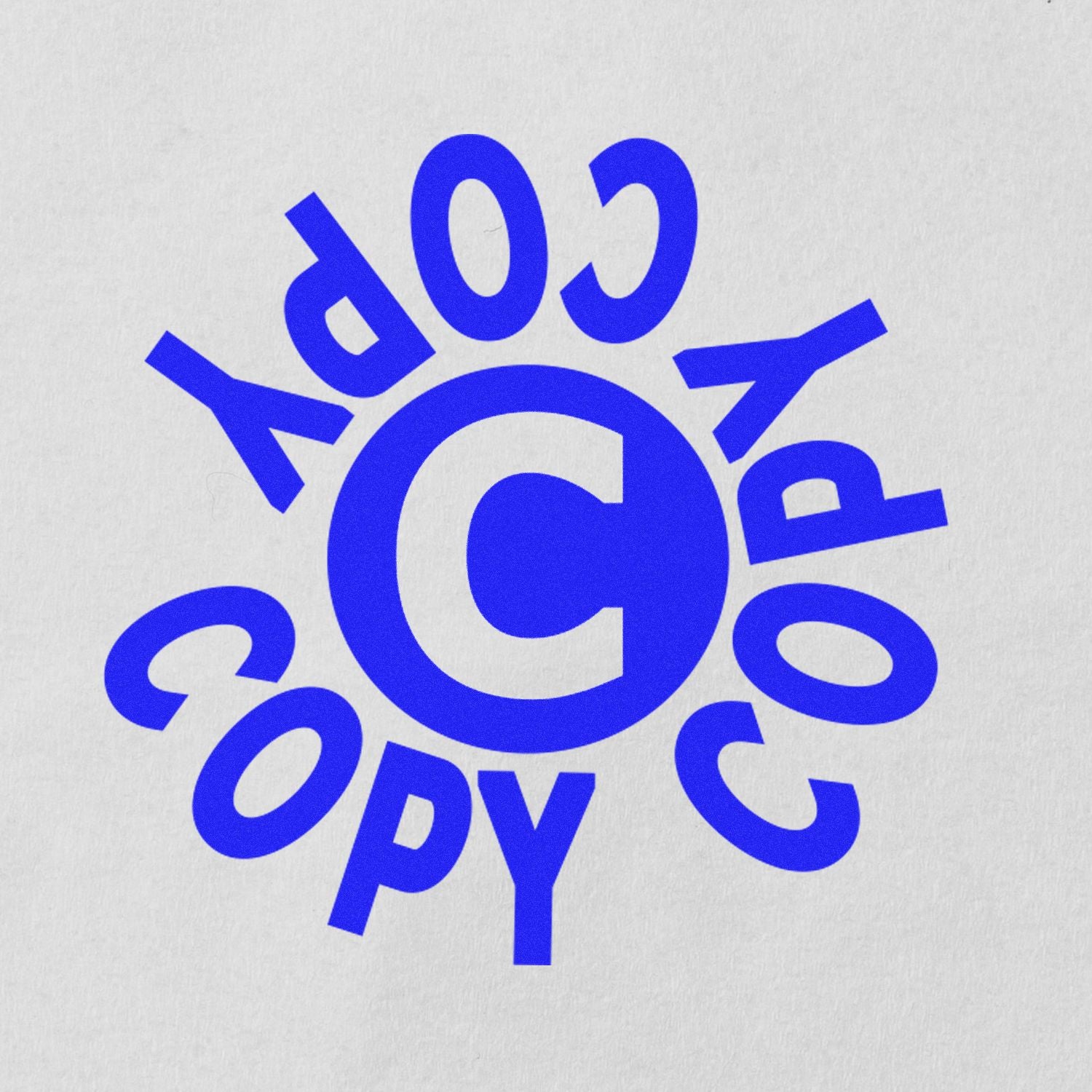 Blue copyright symbol with circular copyright typography logo on a white background.