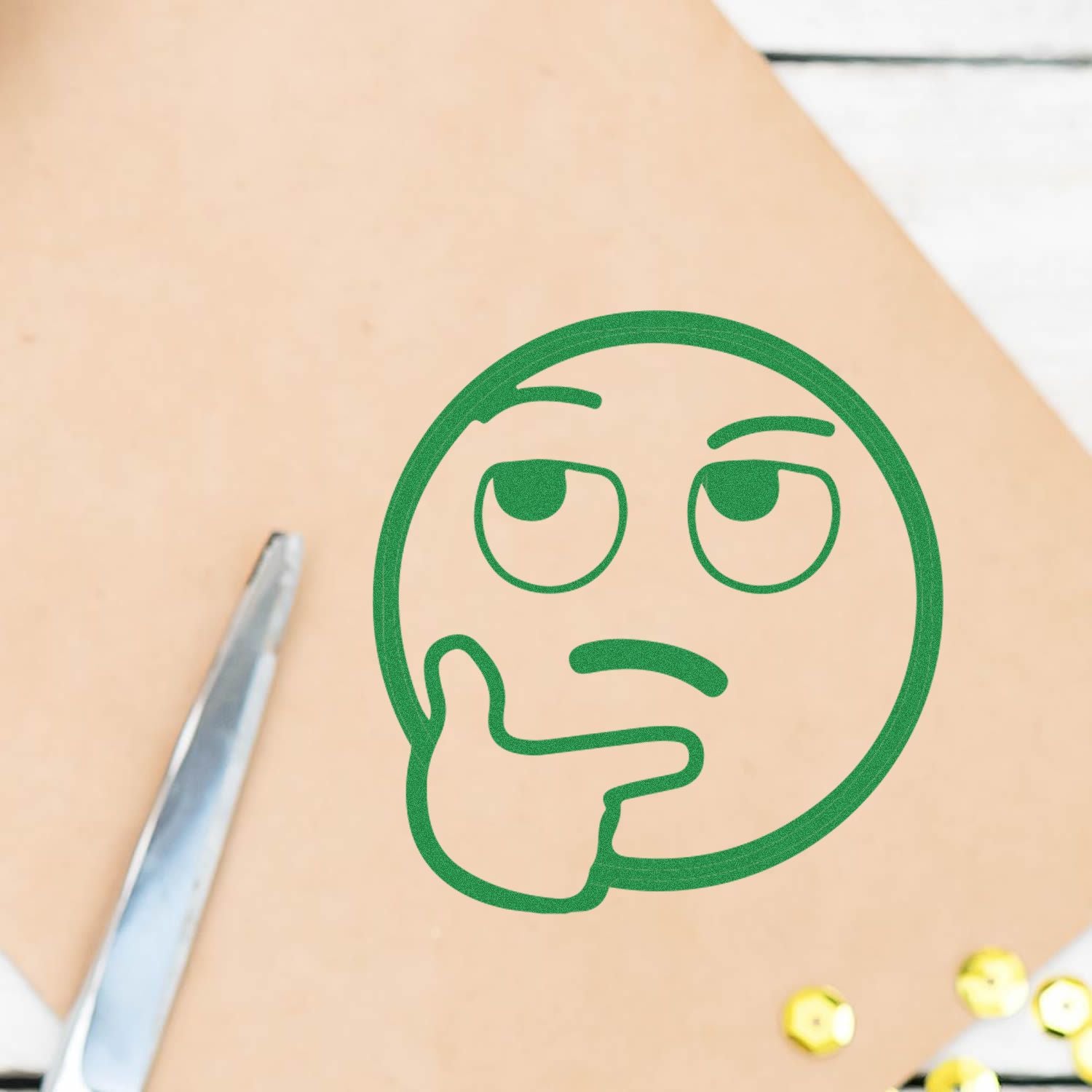 Close-up of skin with tweezers and thoughtful emoji, representing skincare treatment and facial blemish concerns.