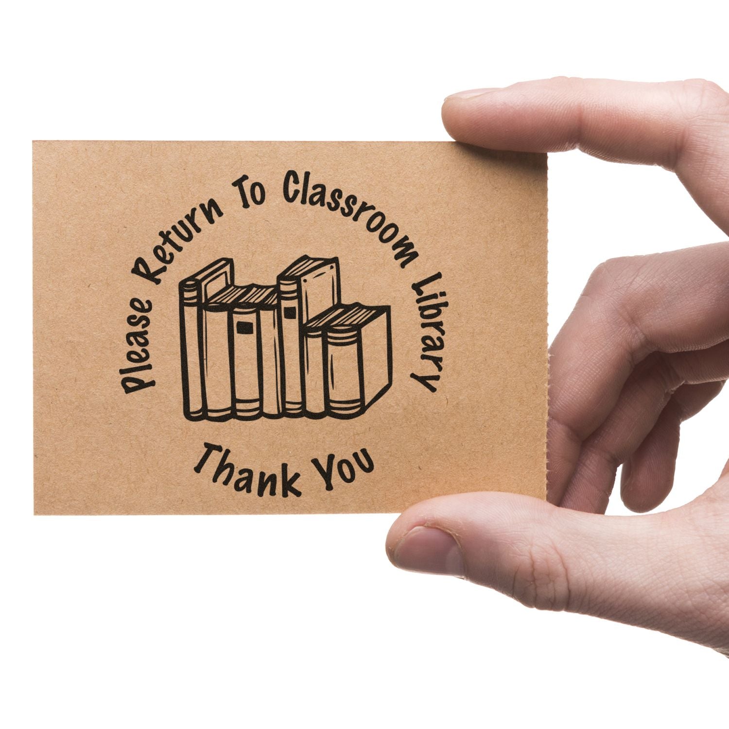 Hand holding a Please Return to Classroom Library thank you card with book icon, educational library return sign.
