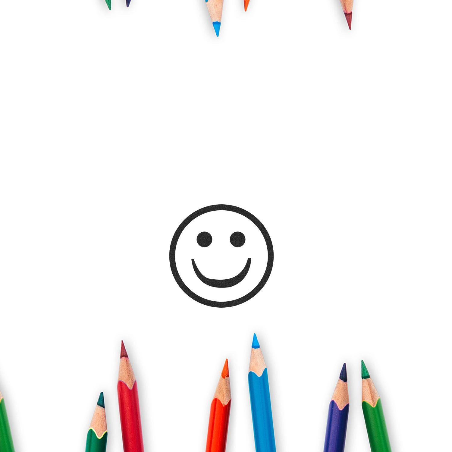 Smiley face icon surrounded by colorful pencils on a white background, creative education and art concept.