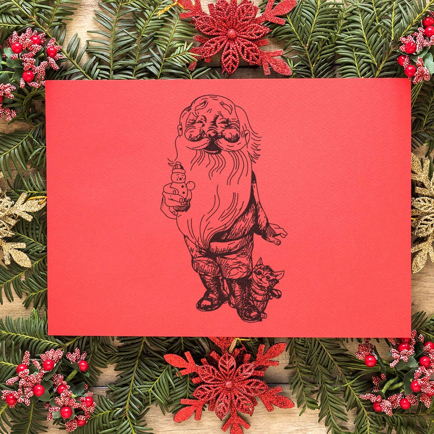 Festive Santa holiday card with black line art on red background, surrounded by Christmas greenery and red decorative accents.