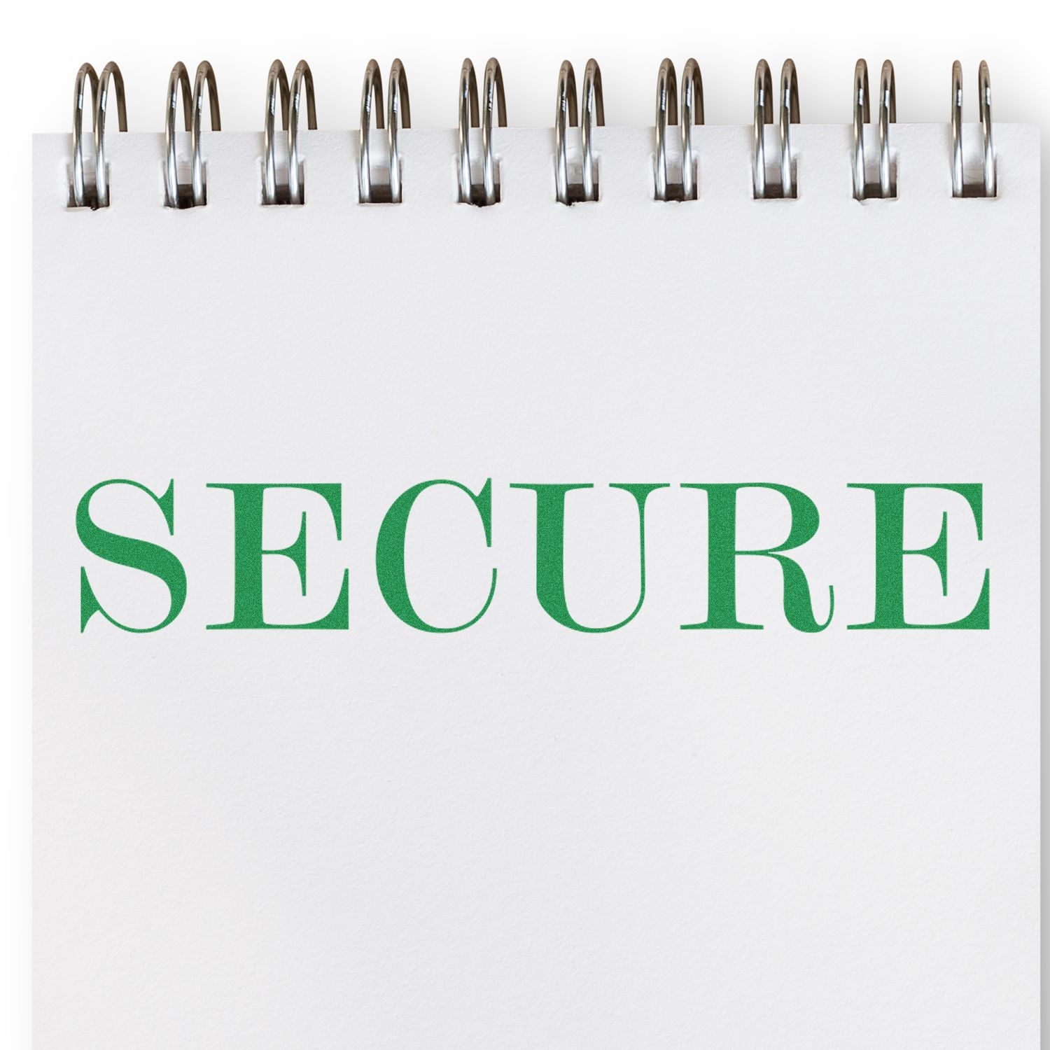White spiral notebook with the word SECURE in green letters, symbolizing security and data protection.