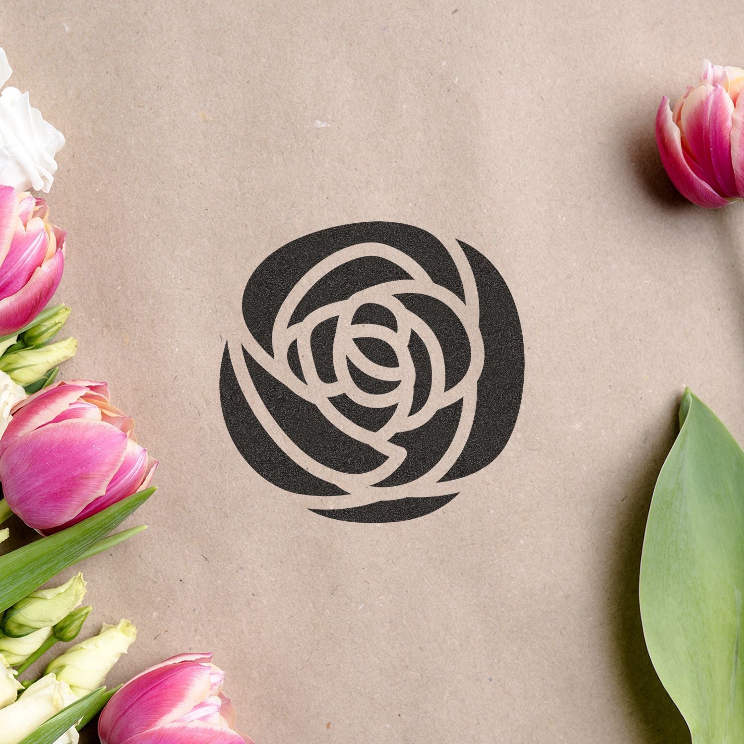 Black floral rose logo on kraft paper background, framed by pink and white tulips with green leaves.