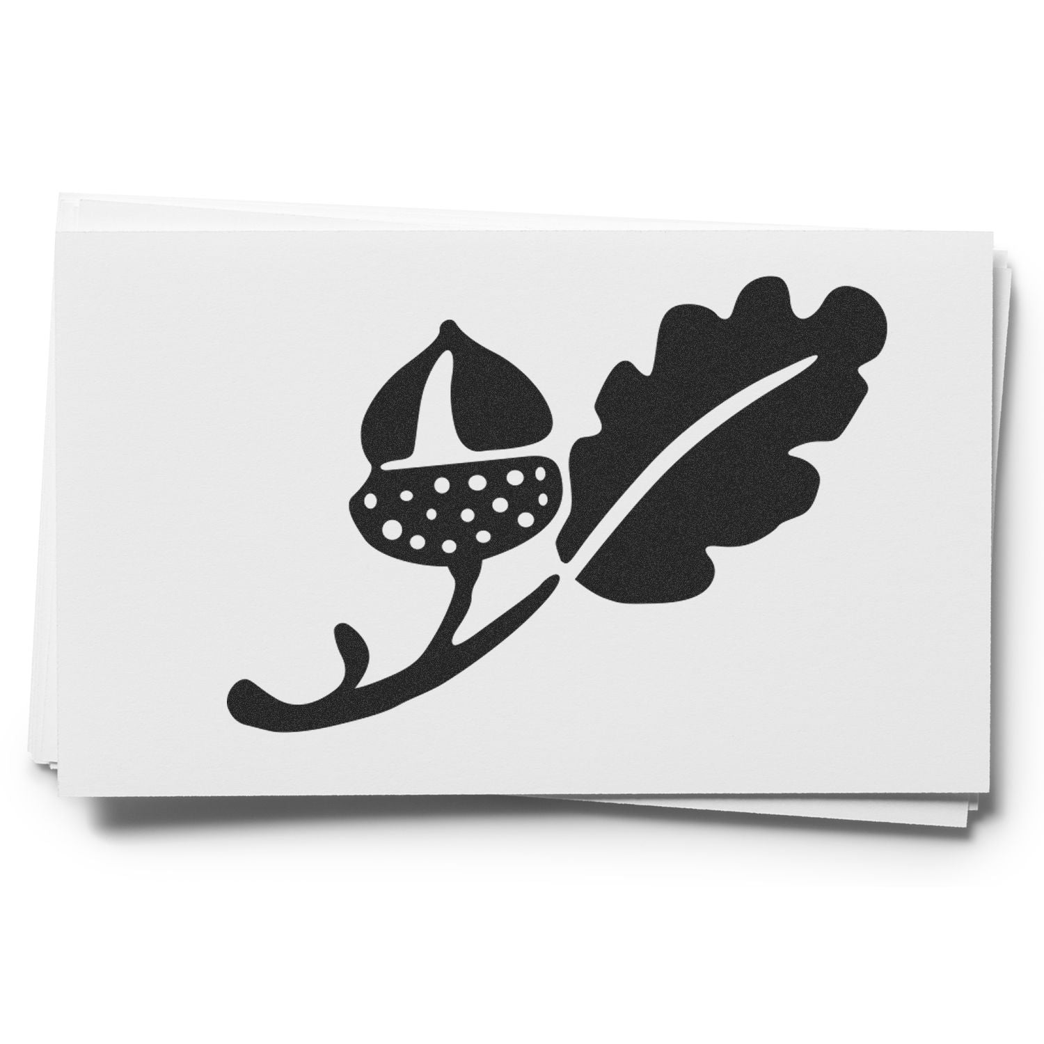 Black acorn and oak leaf logo on stacked white paper cards, minimalist nature design.