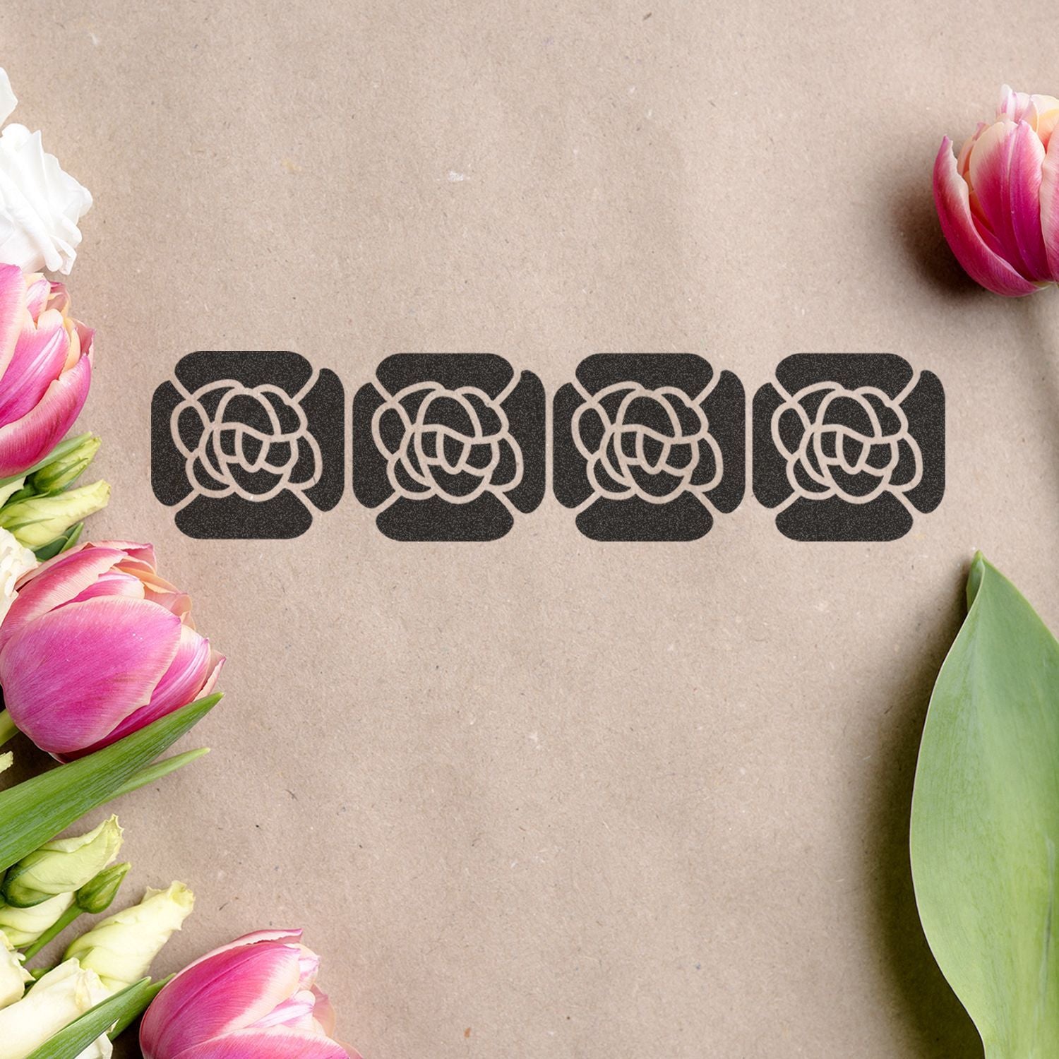 Pink and white tulips framing four black floral logo icons on kraft paper background, elegant minimal branding design