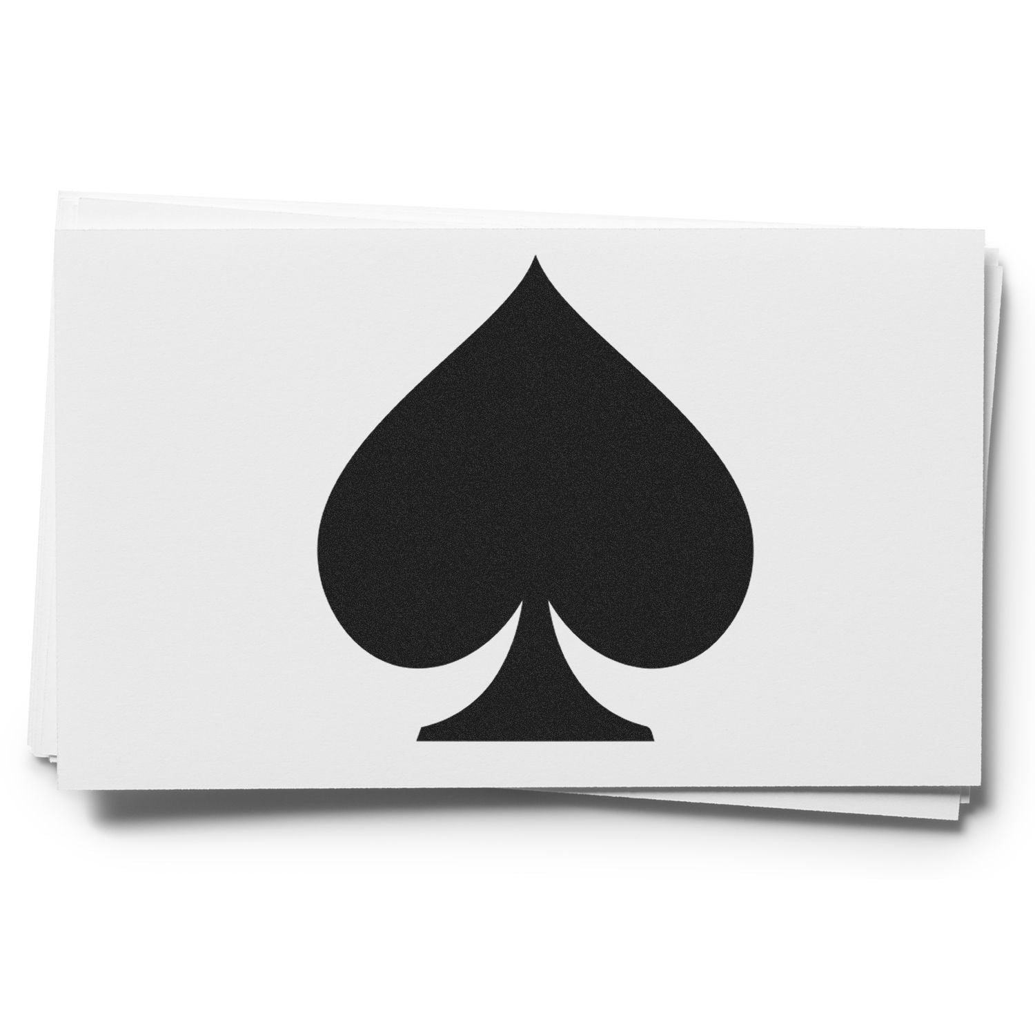 Black ace of spades symbol on a stack of white playing cards isolated on a white background.