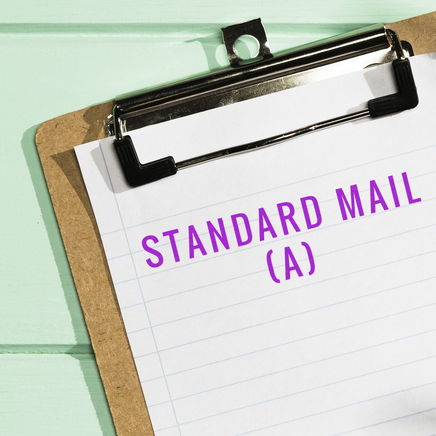 Clipboard holding a paper marked STANDARD MAIL (A), representing direct mail marketing services and delivery.