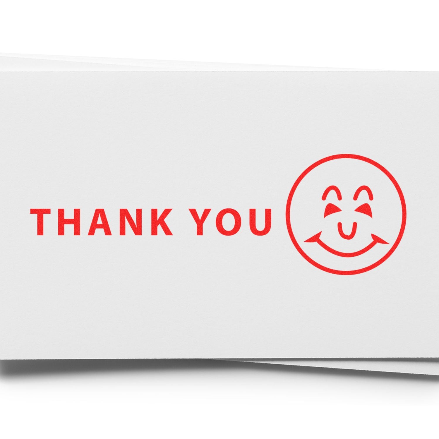 Red Thank You message with smiley face on a white greeting card background.