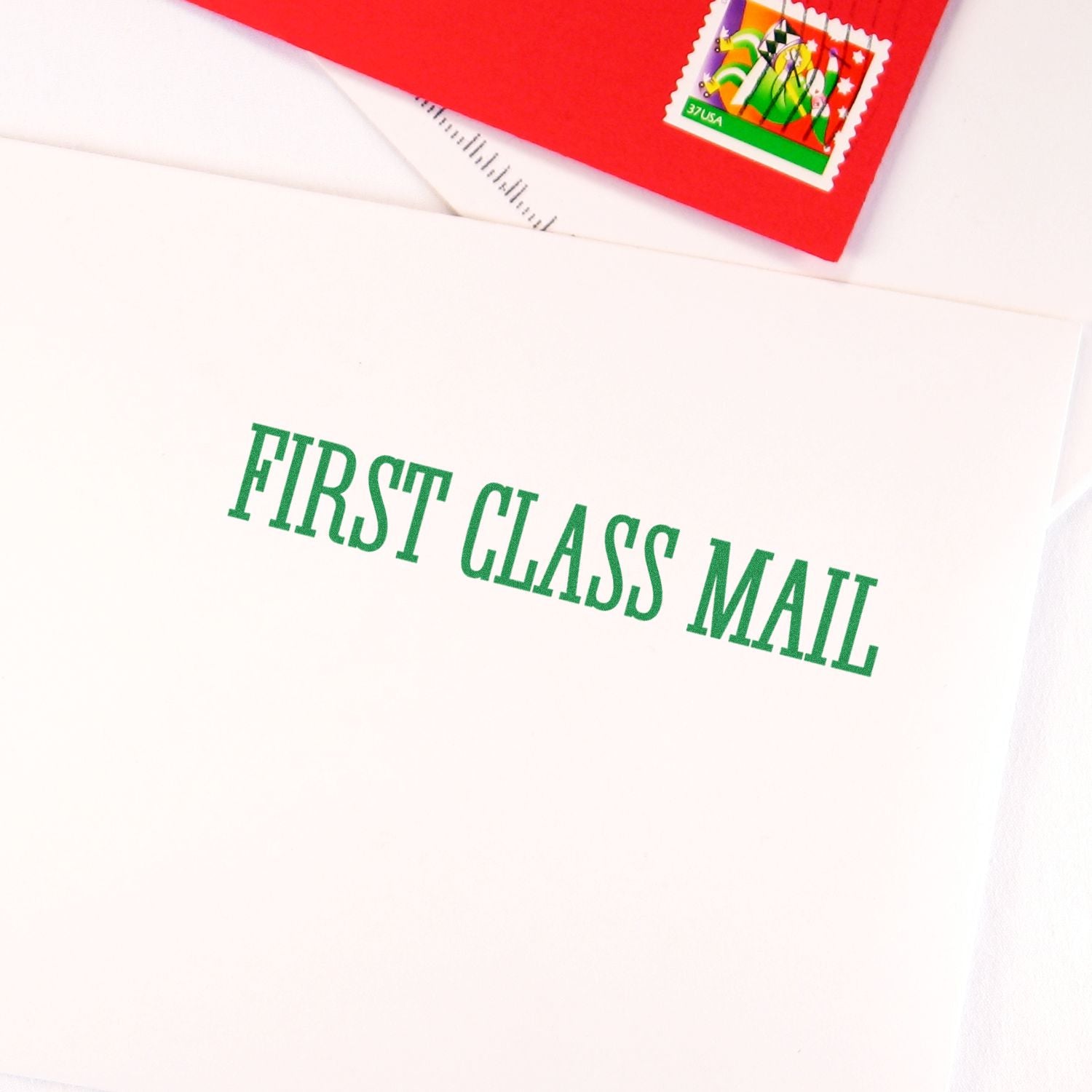 Close-up of USPS First Class Mail envelope with postage stamp, highlighting First Class Mail shipping service for sending letters