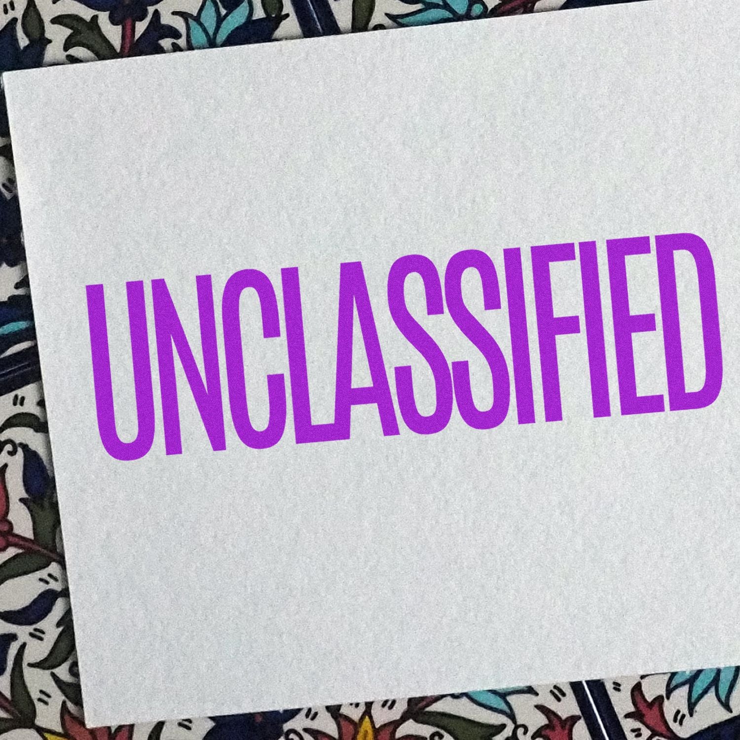 White card with bold purple 'UNCASHED' lettering, indicating an uncashed check or payment status for finance records.
