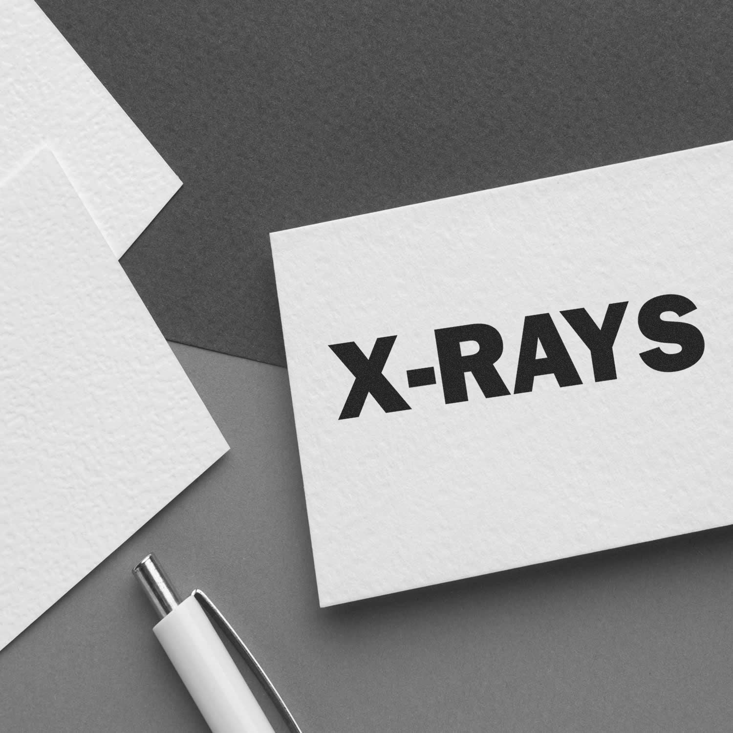 X-RAYS concept on medical paperwork with pen, highlighting radiology testing and diagnostic imaging services