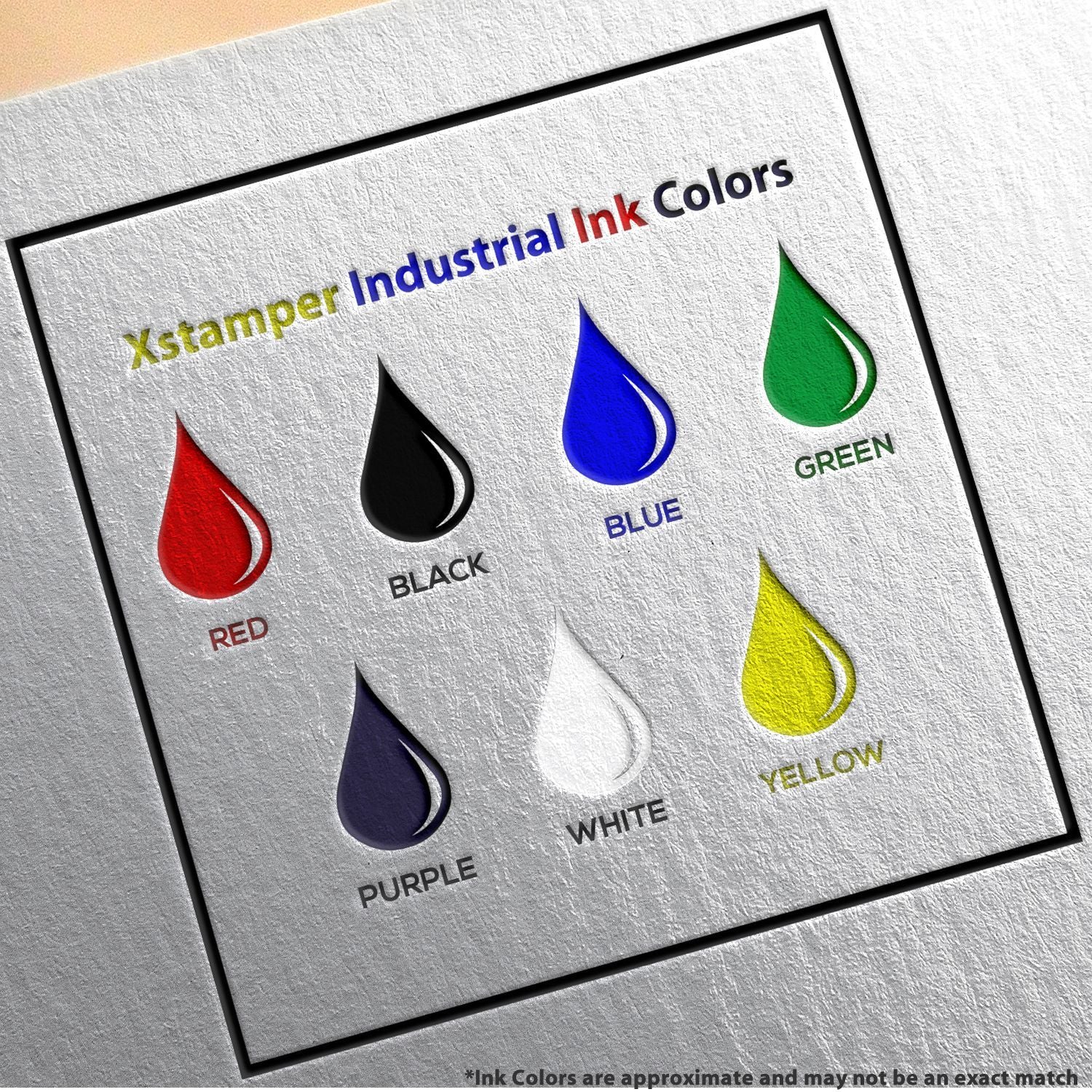 Xstamper industrial ink colors chart showing red, black, blue, green, purple, white, and yellow ink samples on textured paper.