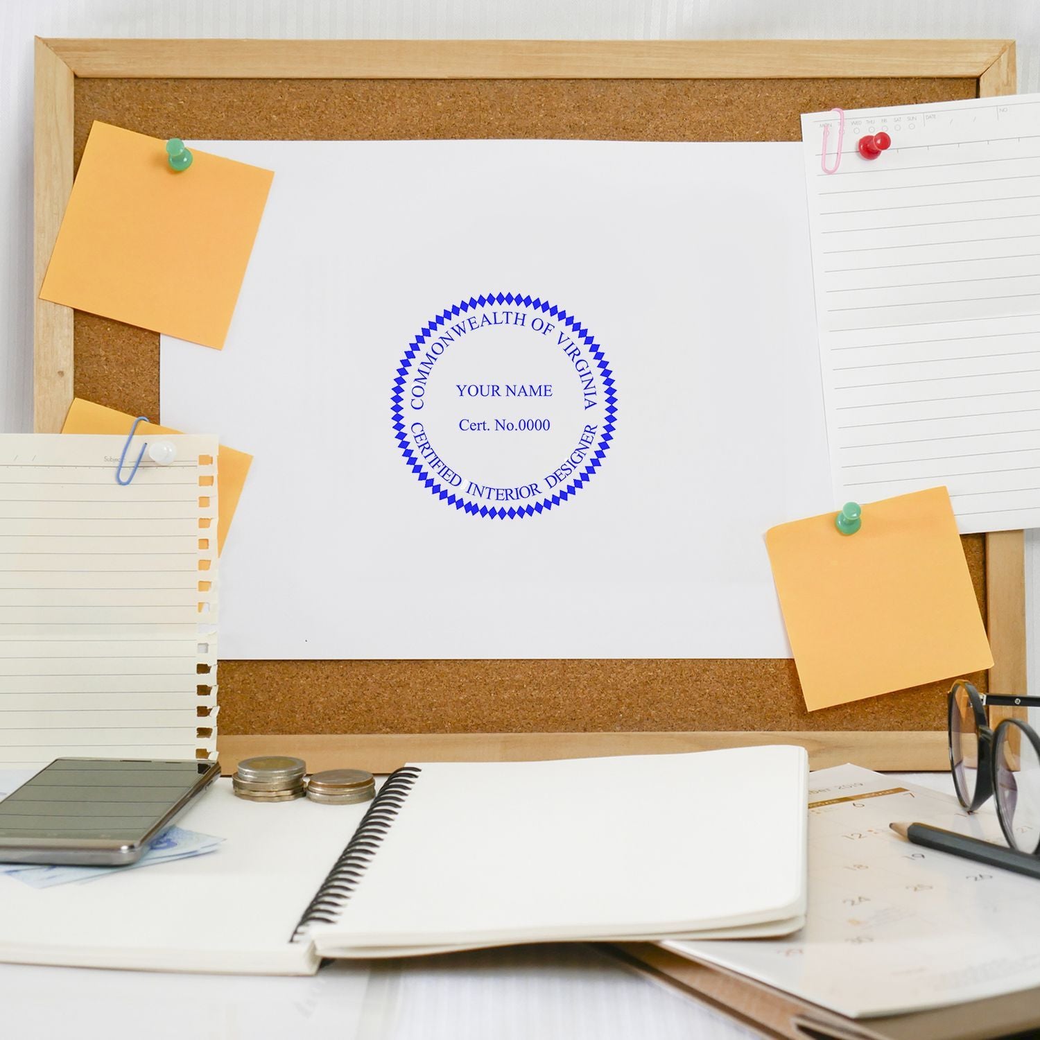 Corkboard with Commonwealth of Virginia certified interior designer certificate, sticky notes, notebooks, and office desk supplies.