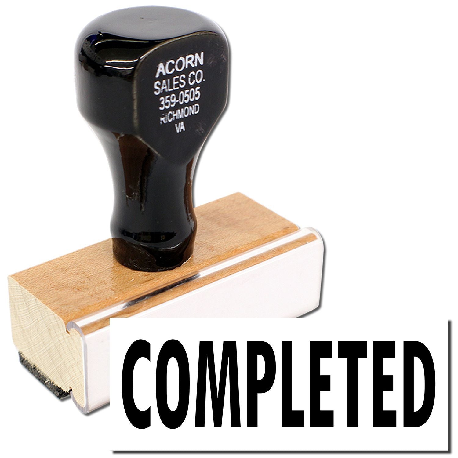 Completed stamp with Acorn Sales Co. phone number on black handle, used for marking documents as finished.