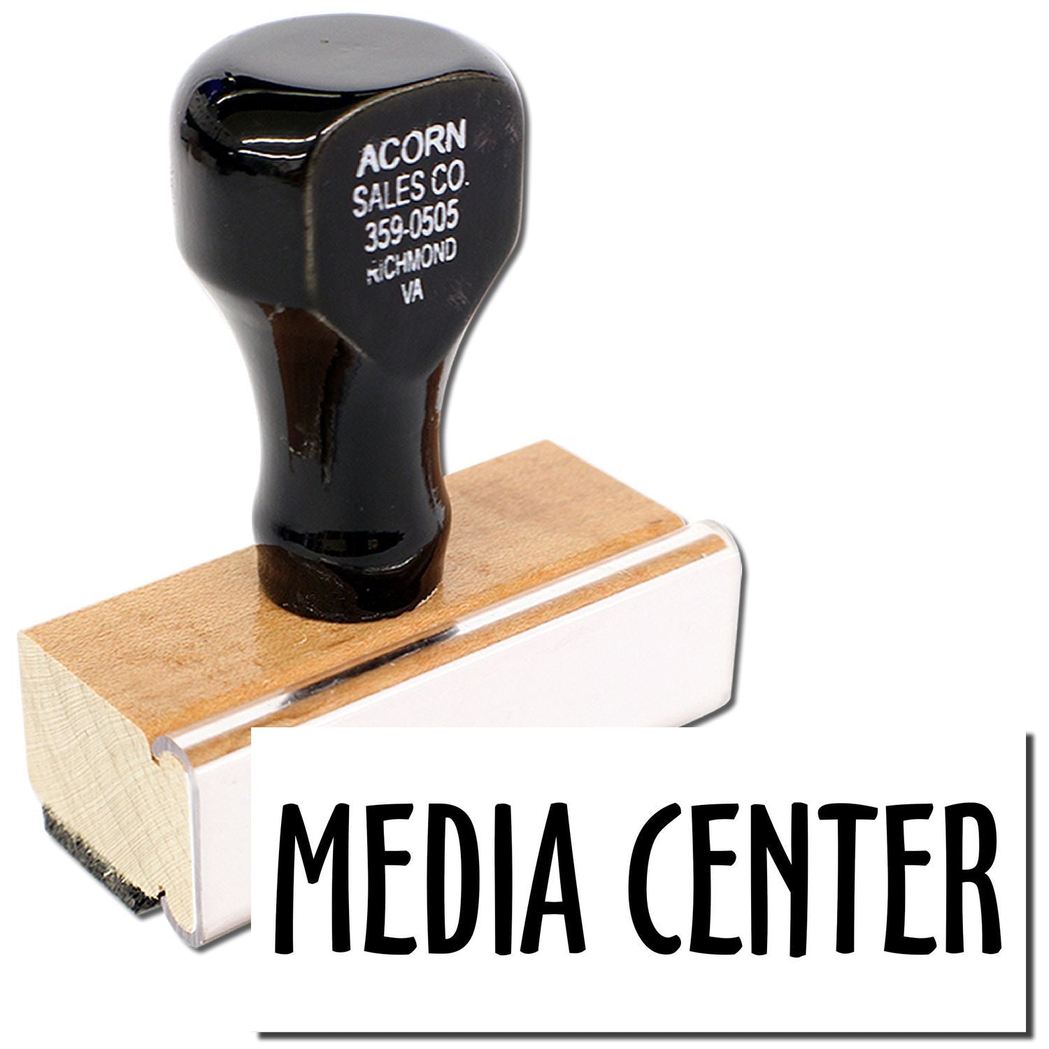 Acorn Sales Co. branded rubber mallet handle on wooden block with MEDIA CENTER text for promotional display.