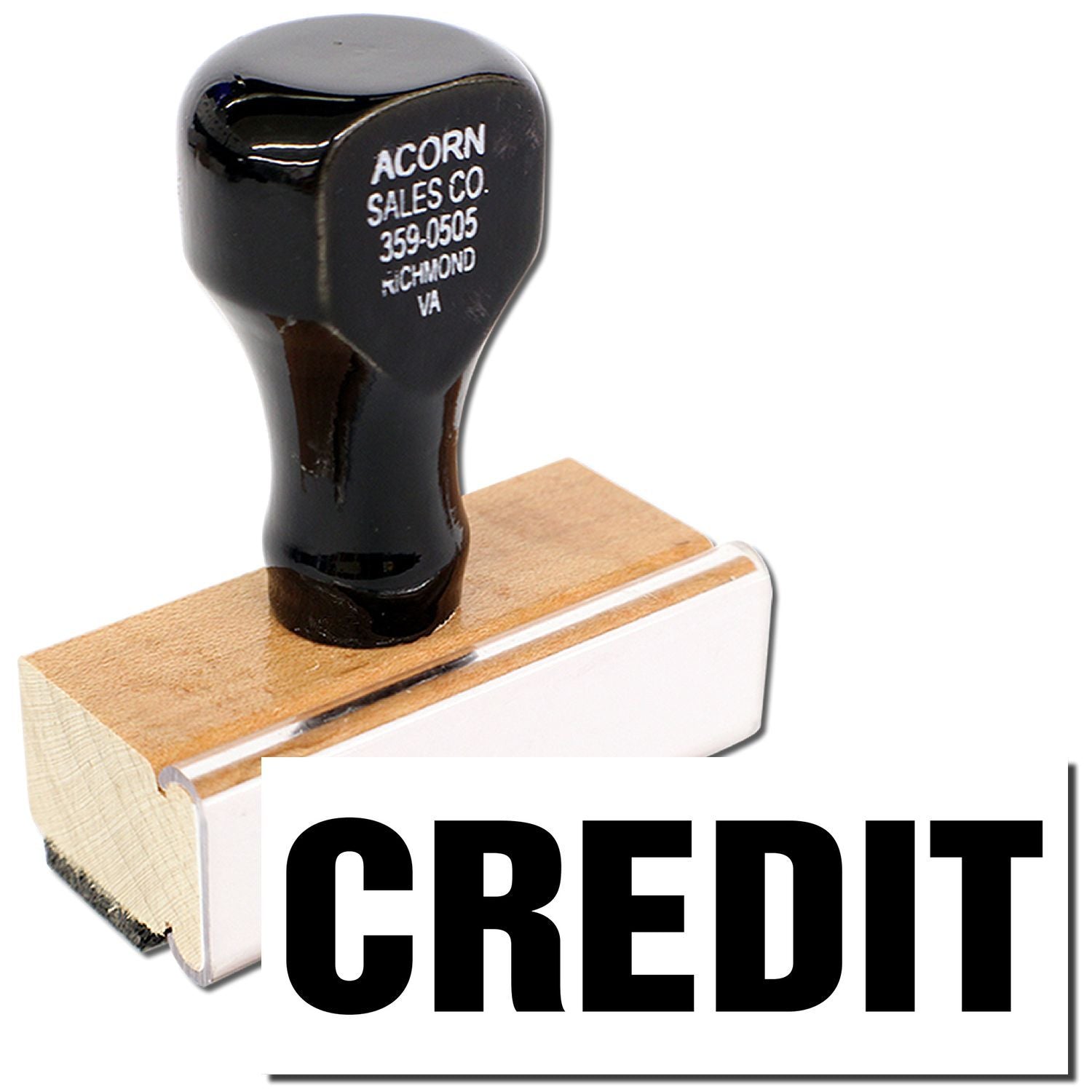 Acorn Sales Co. promotional logo on black stamp over wooden block labeled phone number Richmond VACredit stamp