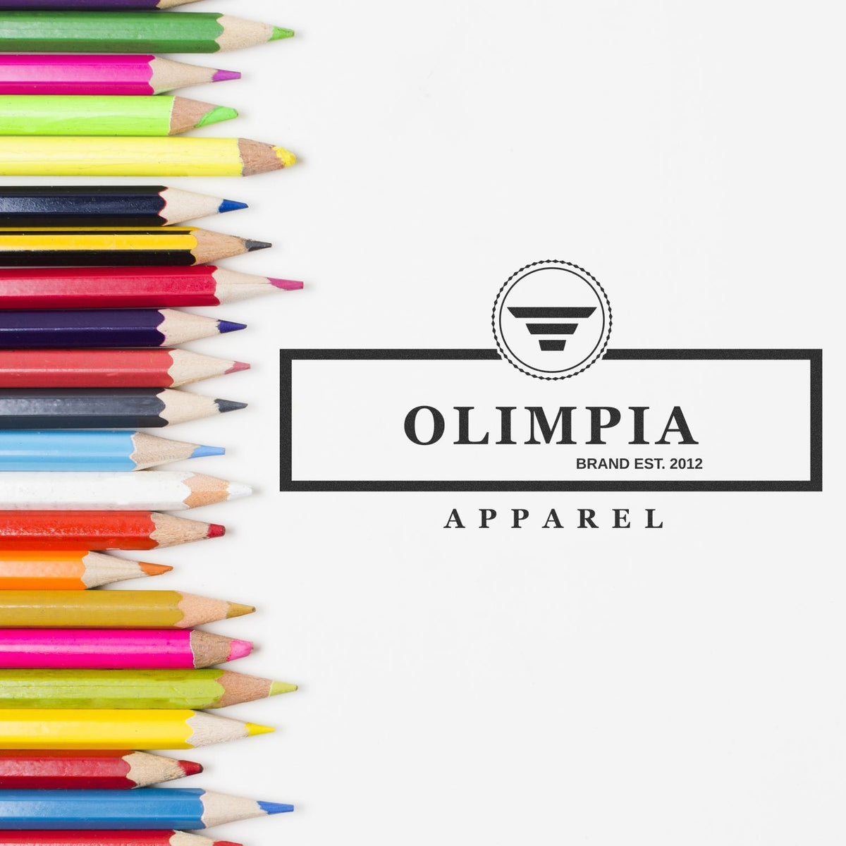 Colorful pencils framing Olimpia Apparel logo on white background with brand est. 2012 text.