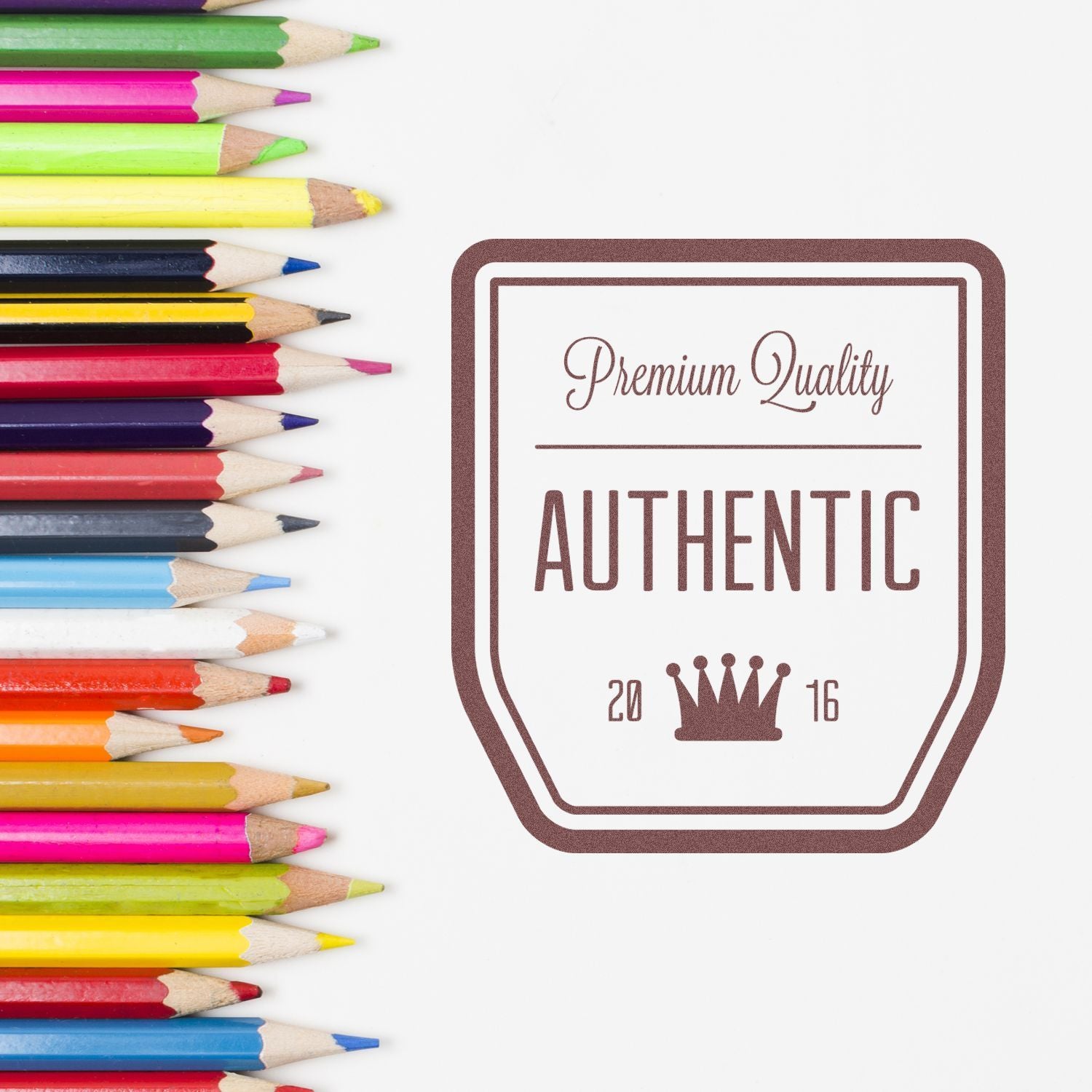 Premium Quality Authentic badge beside colorful pencils, highlighting high-quality authentic stationery and art supplies for 2016.