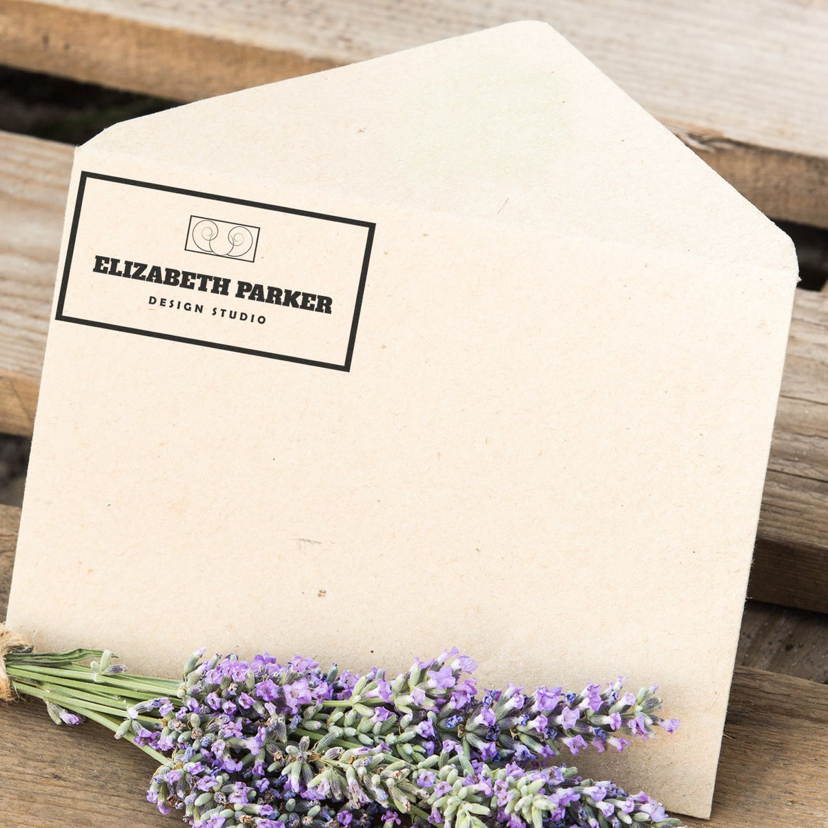 Elizabeth Parker Design Studio custom stationery with lavender flowers on rustic wooden background, branding and gift packaging.