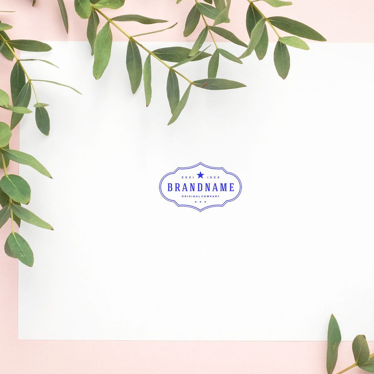 Botanical brand logo mockup with green eucalyptus leaves on pink and white background, featuring BRANDNAME Original Company emblem