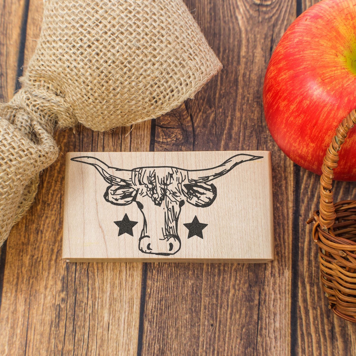 Longhorn skull rubber stamp on rustic wood with apple and burlap decor, western farmhouse style craft accessory