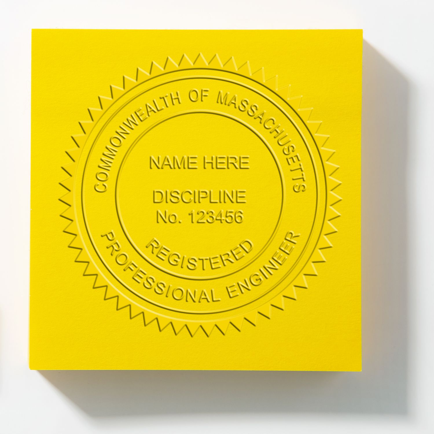 Yellow embossed Commonwealth of Massachusetts Professional Engineer registered seal with name and discipline placeholder.