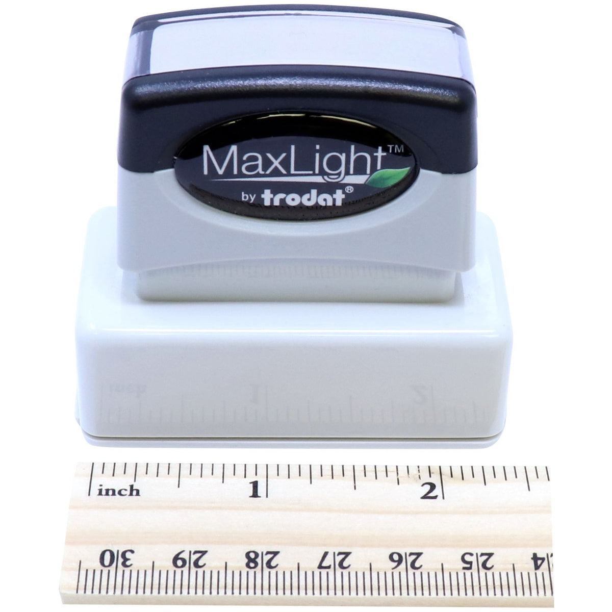 Trodat MaxLight ink stamp with size shown beside an inches ruler, close-up product branding for labeling and marking.