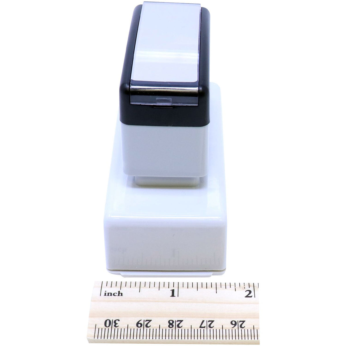 Front view of compact electronic device with display window; size shown with inch measurement ruler for product dimensions reference.