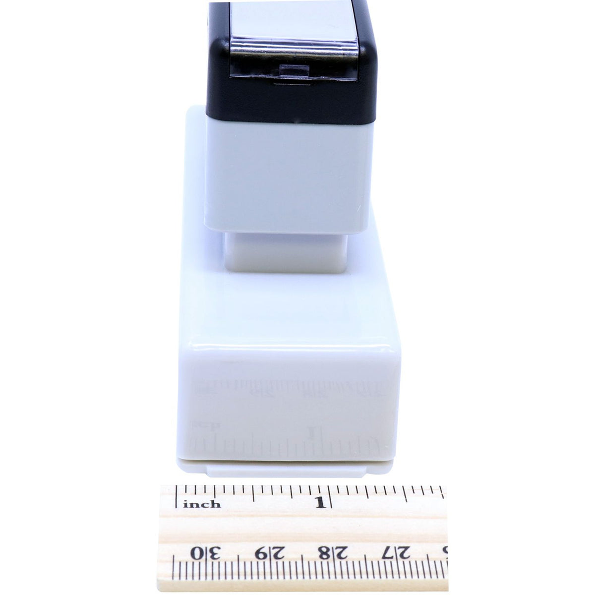 Close-up of compact white and black electronic device module, with ruler showing product size and dimensions for ecommerce.