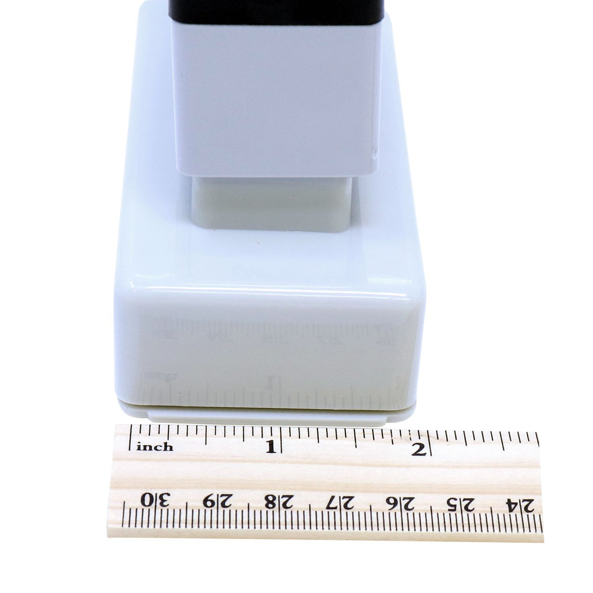 White medical device housing measured against an inch ruler, showing product dimensions for accurate sizing and listing