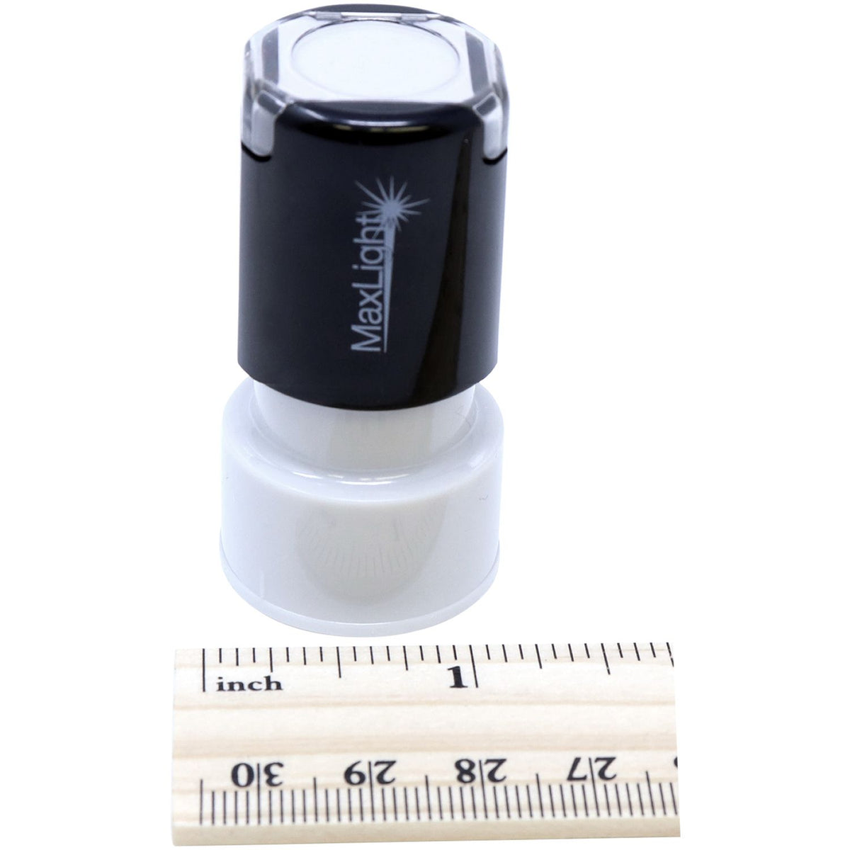 Black Maxiolx device housing component shown with ruler for accurate size measurement on white background, front view.