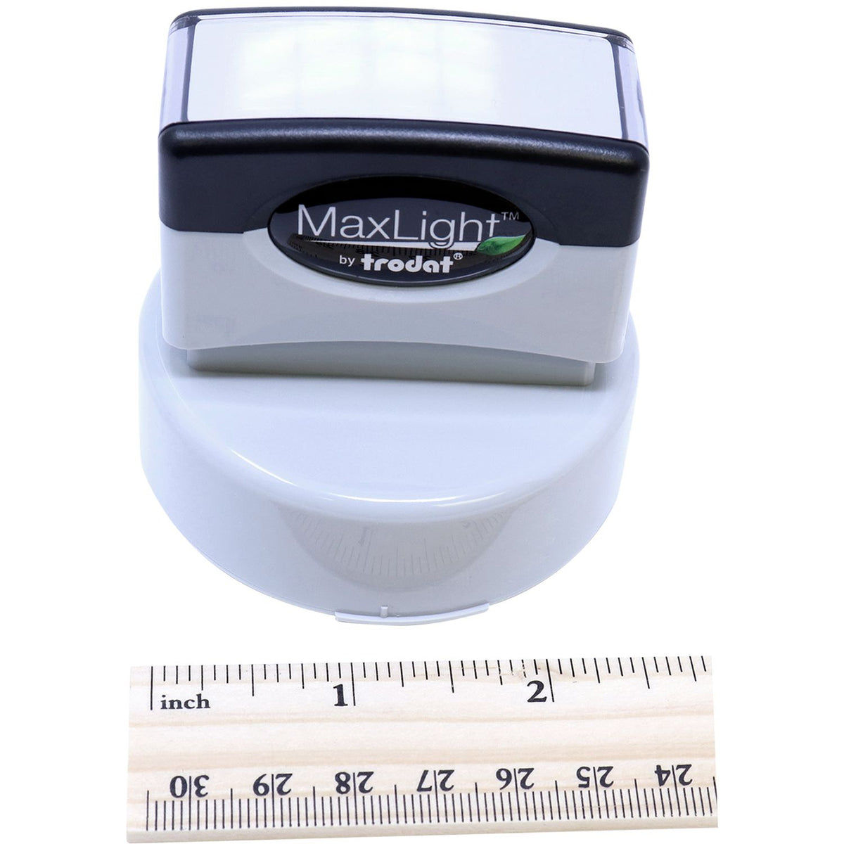 Trodat MaxLight product head with size measurement ruler, showing compact dimensions for lighting devices