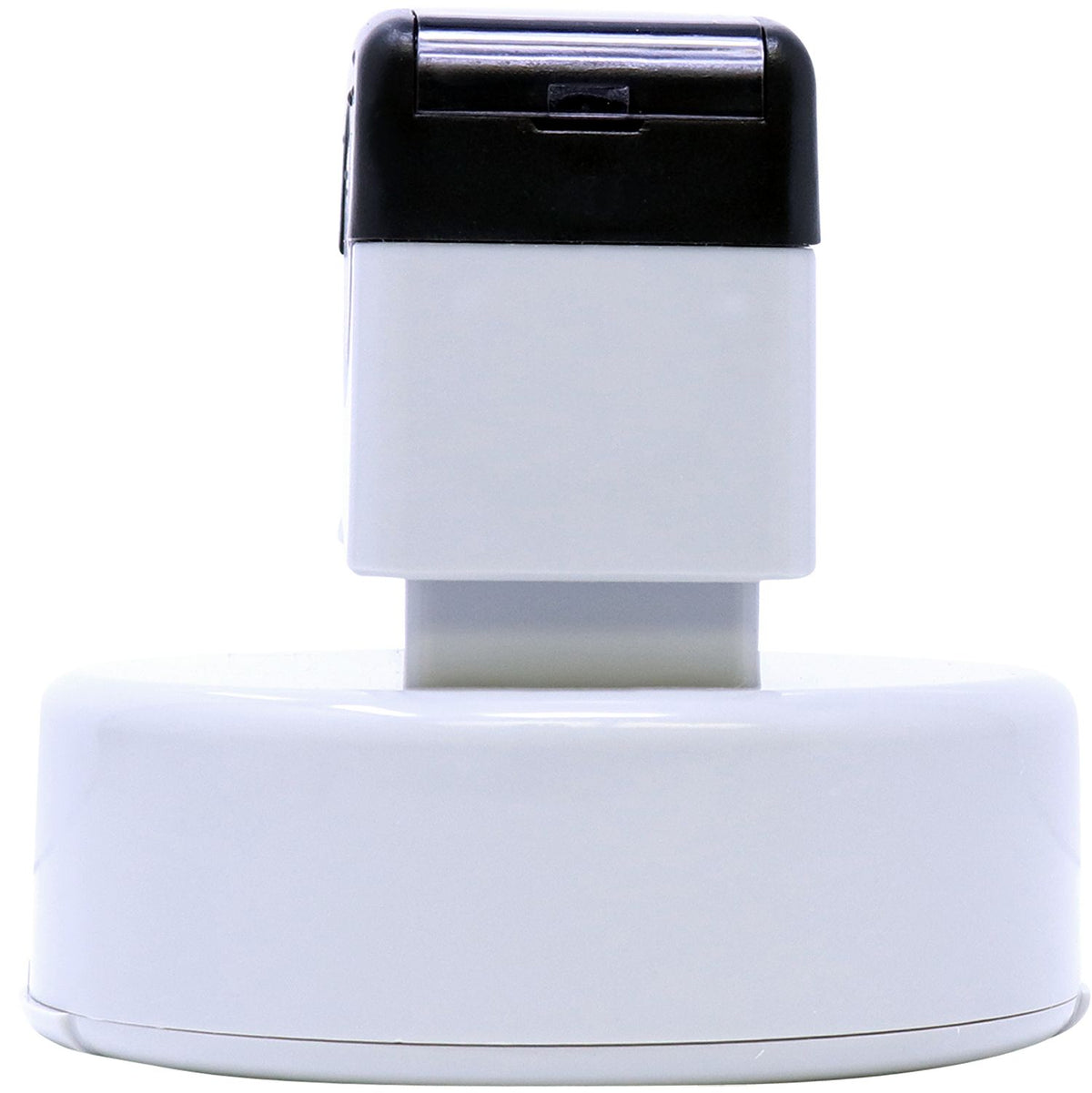 Close-up of an electronic appliance top housing with black cover for controls, showing compact white base for home maintenance use