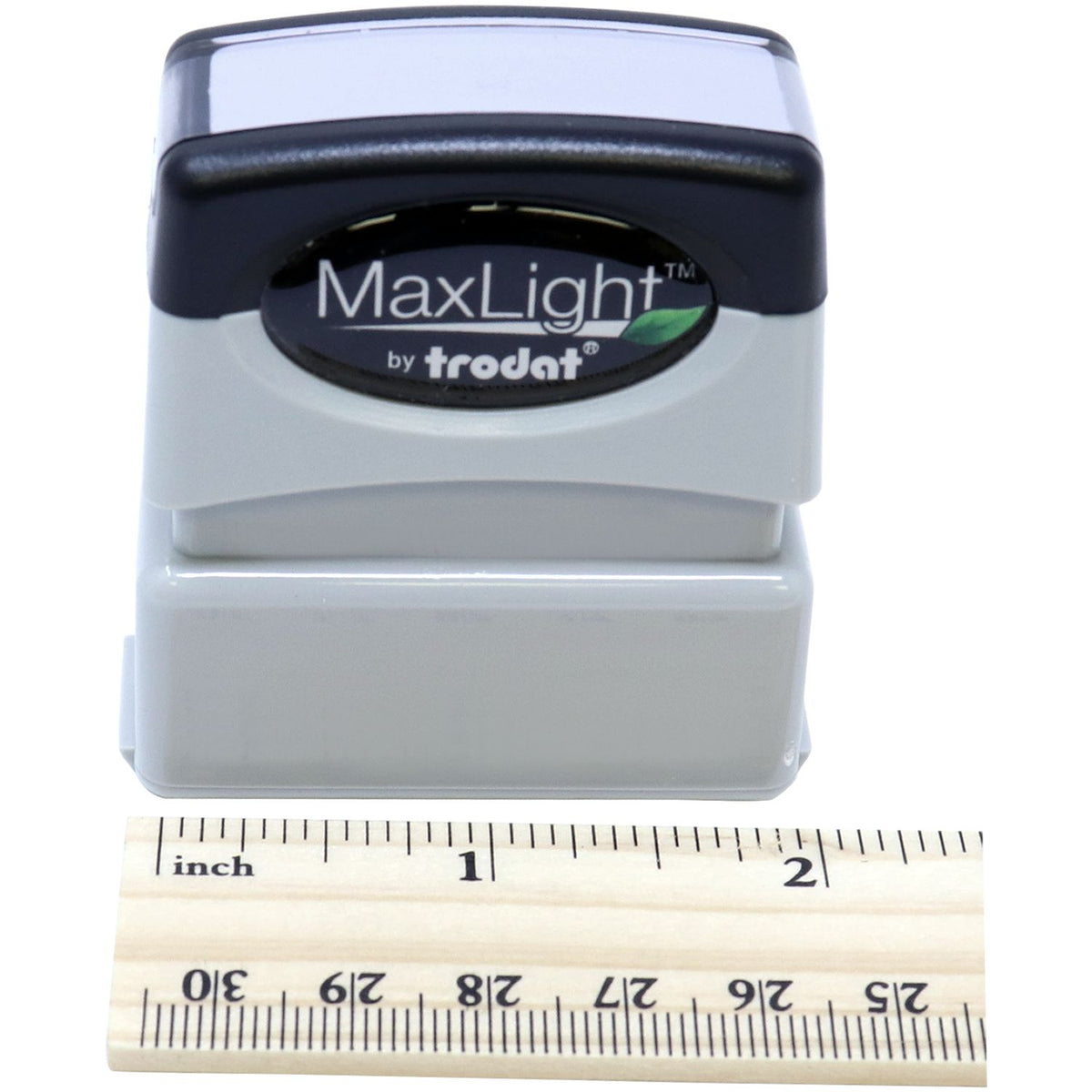 Close-up of MaxLight by Trodat self-inking stamp with inches measuring ruler for product size reference