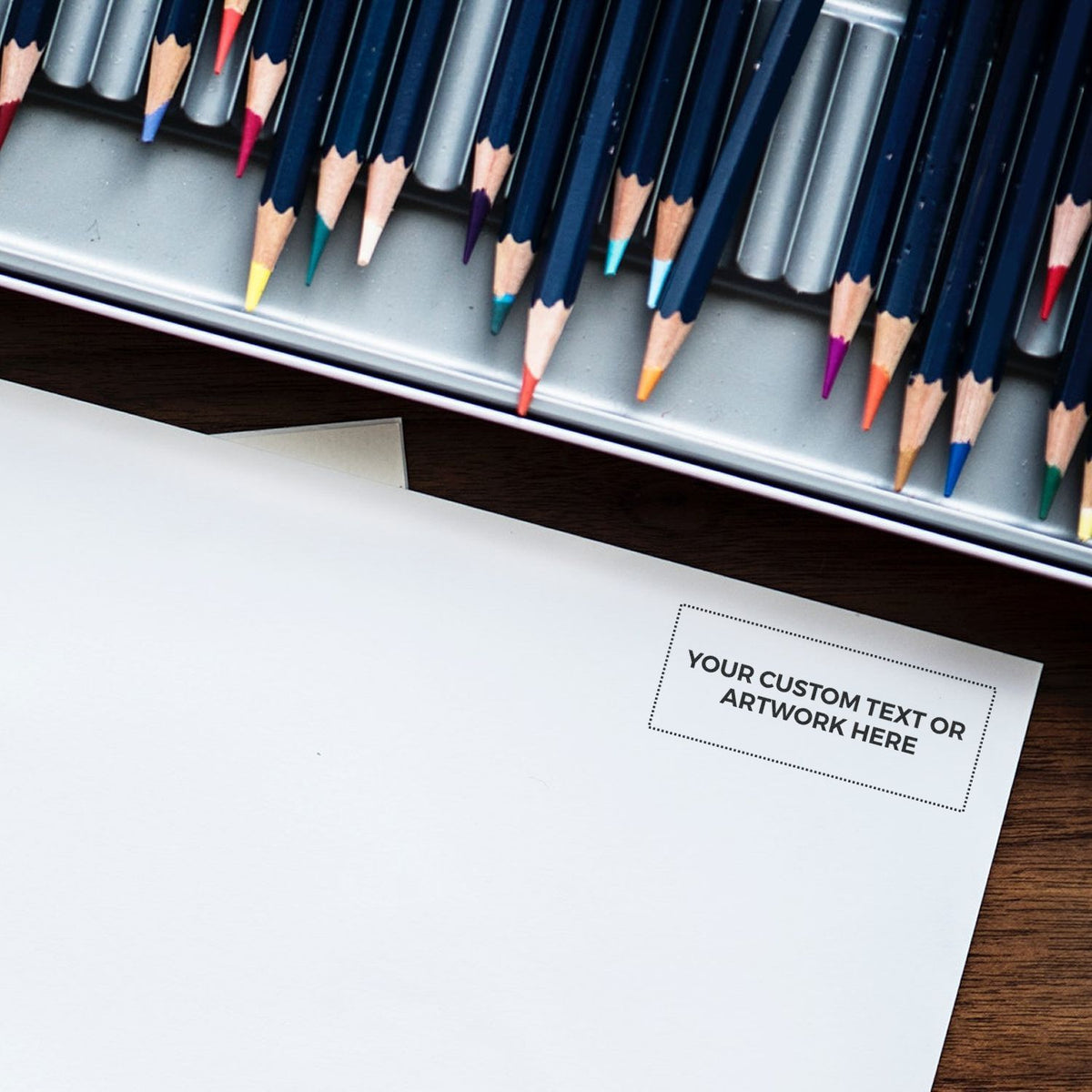 Colored pencils in organizer above blank paper, ideal stationery art workspace with custom text placeholder for design mockup