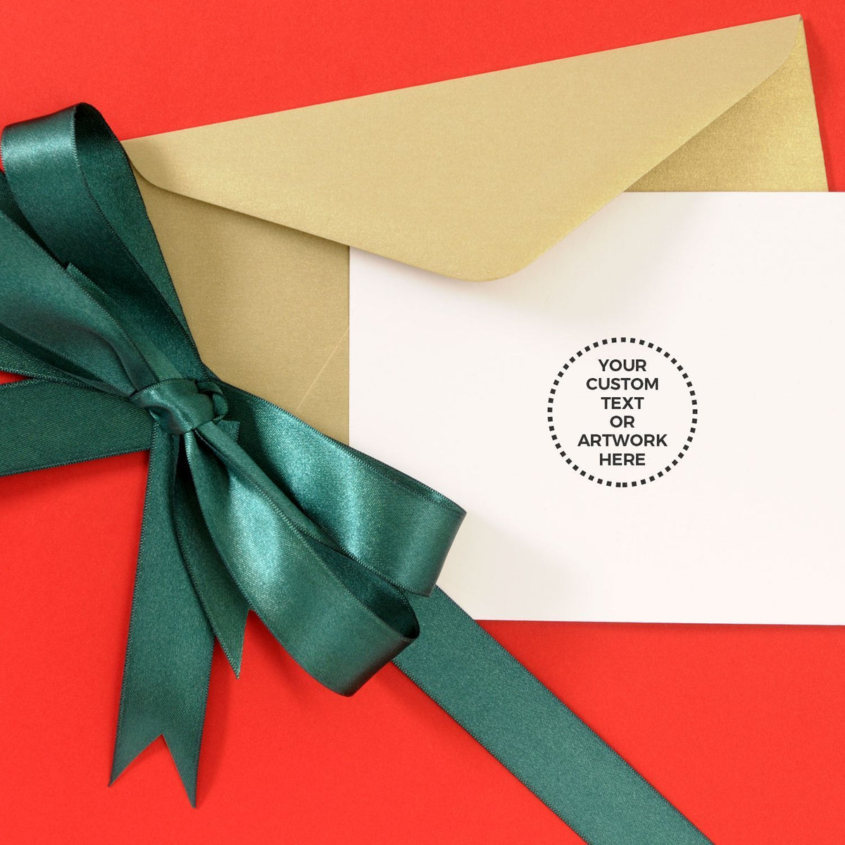 Custom greeting card mockup with gold envelope, teal satin ribbon bow and blank insert for message or artwork on red background
