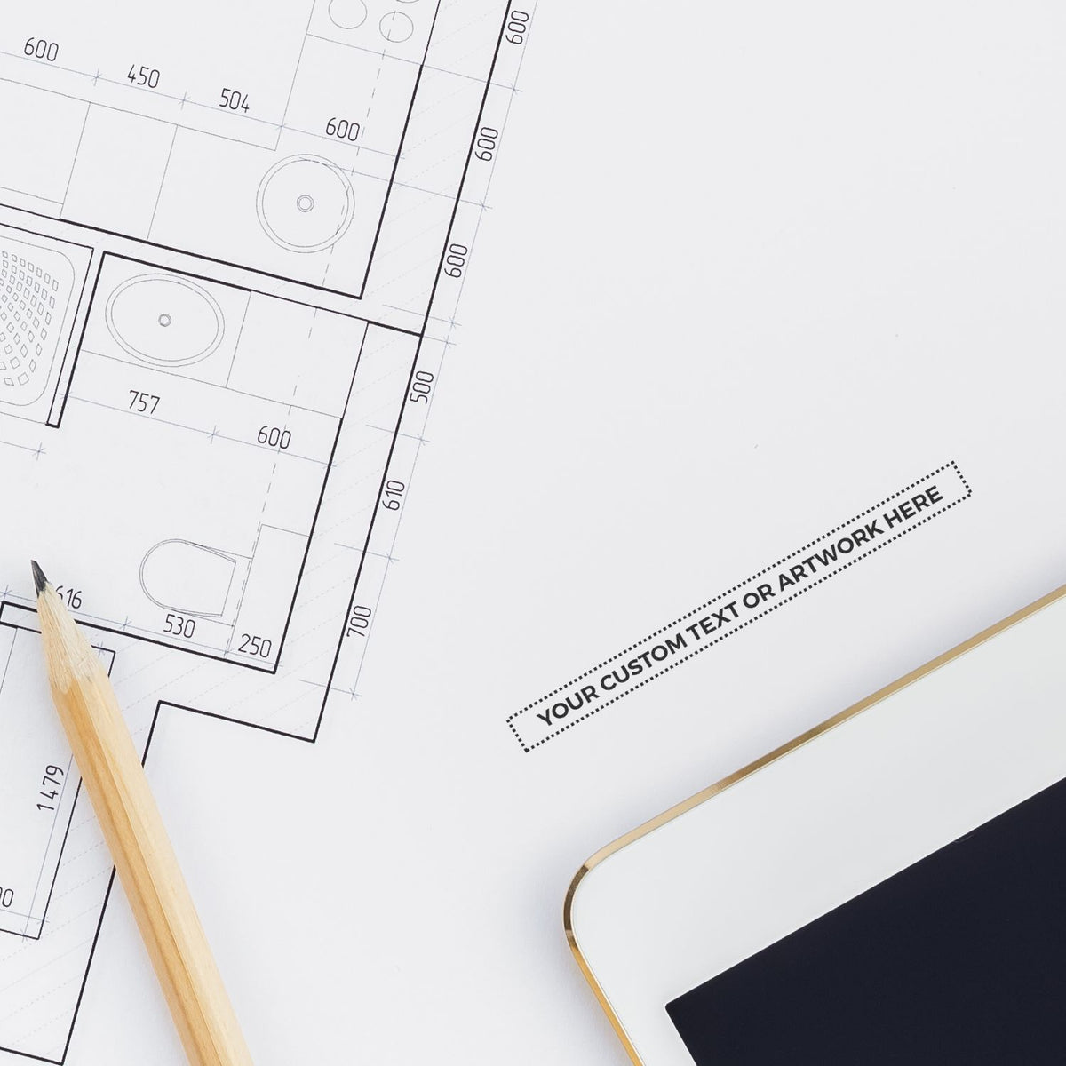 Architectural blueprint floor plan with room measurements, pencil, and laptopplanning and design document layout for construction.