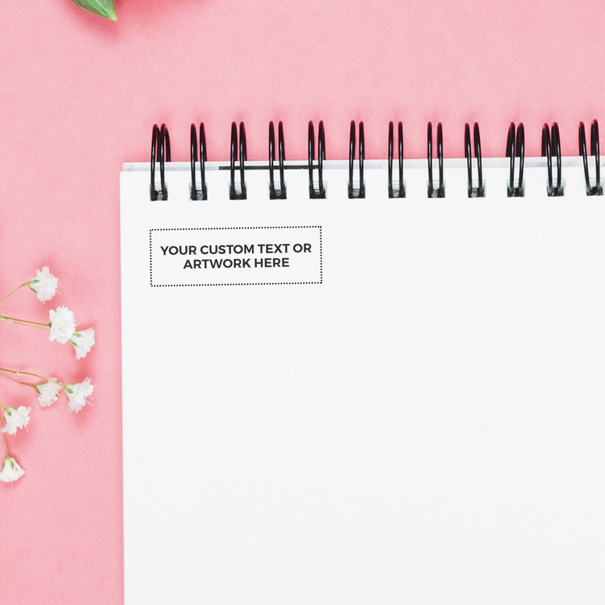 Pink spring-style notebook cover template with black spiral binding and space for custom text for stationery branding and marketing message