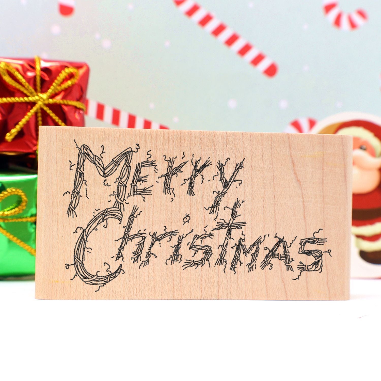 Wooden Merry Christmas sign with festive holiday gift boxes in the background