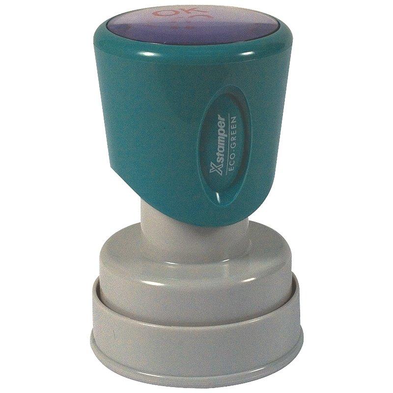 XpressGreen eco-friendly self-inking stamp with green ink pad top and gray base for office document marking and labeling for shipping records.