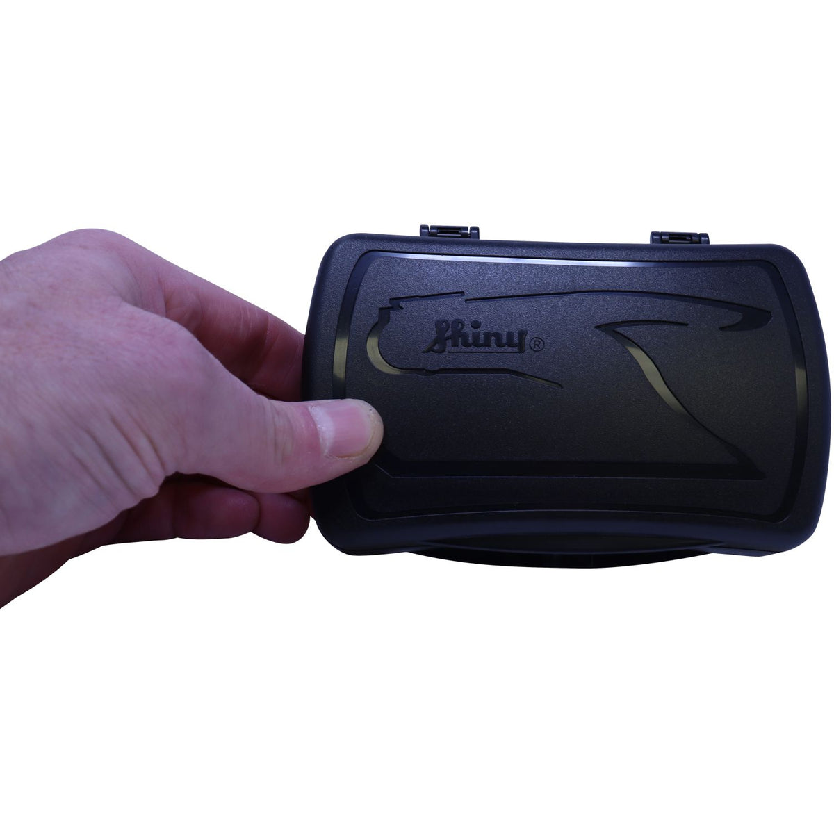 Hand holding black Shiny self-inking stamp case on white background