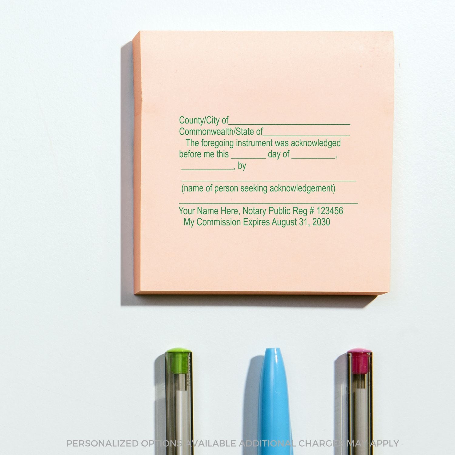 Custom notary public acknowledgment stamp with personalized options and pens on a white background