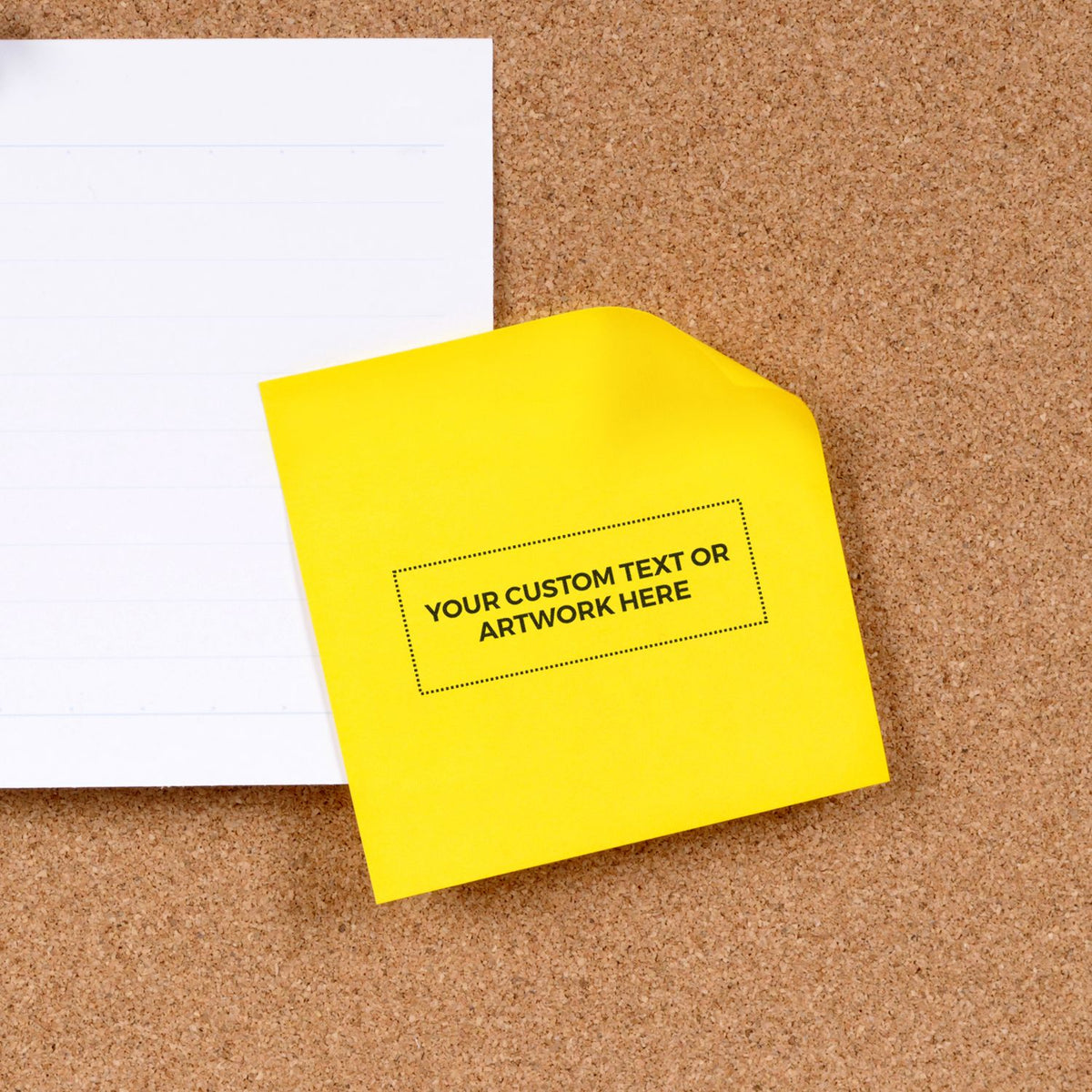 Yellow sticky note with custom text placeholder on corkboard beside blank lined paper, office memo template mockup.