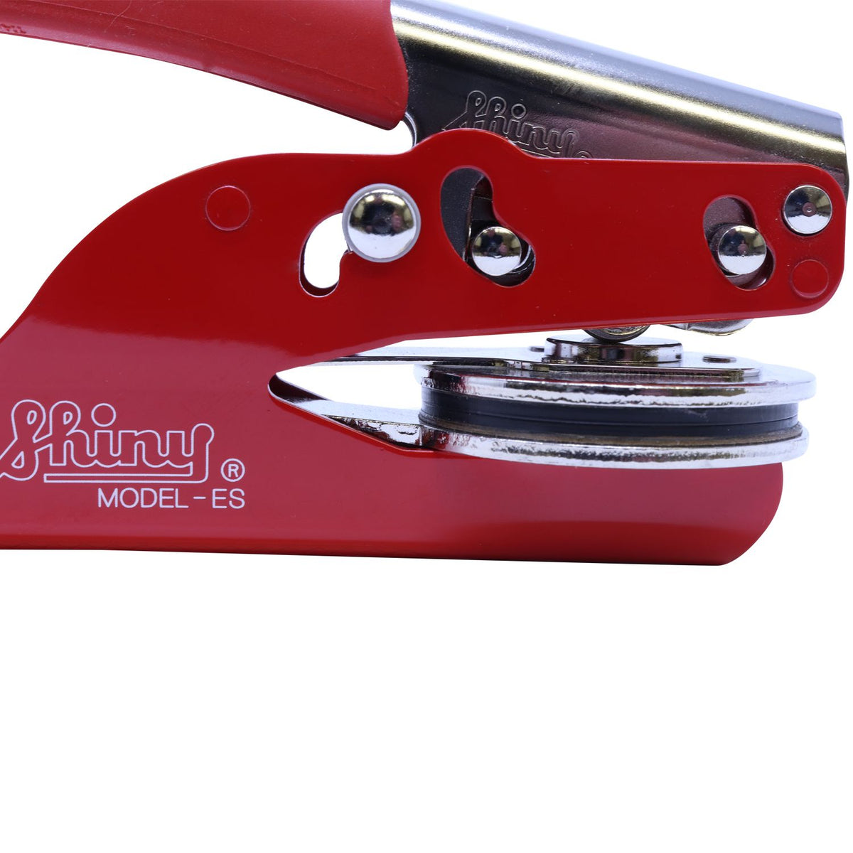 Close-up of a red Shiny Model ES handheld embossing seal press with chrome metal components.