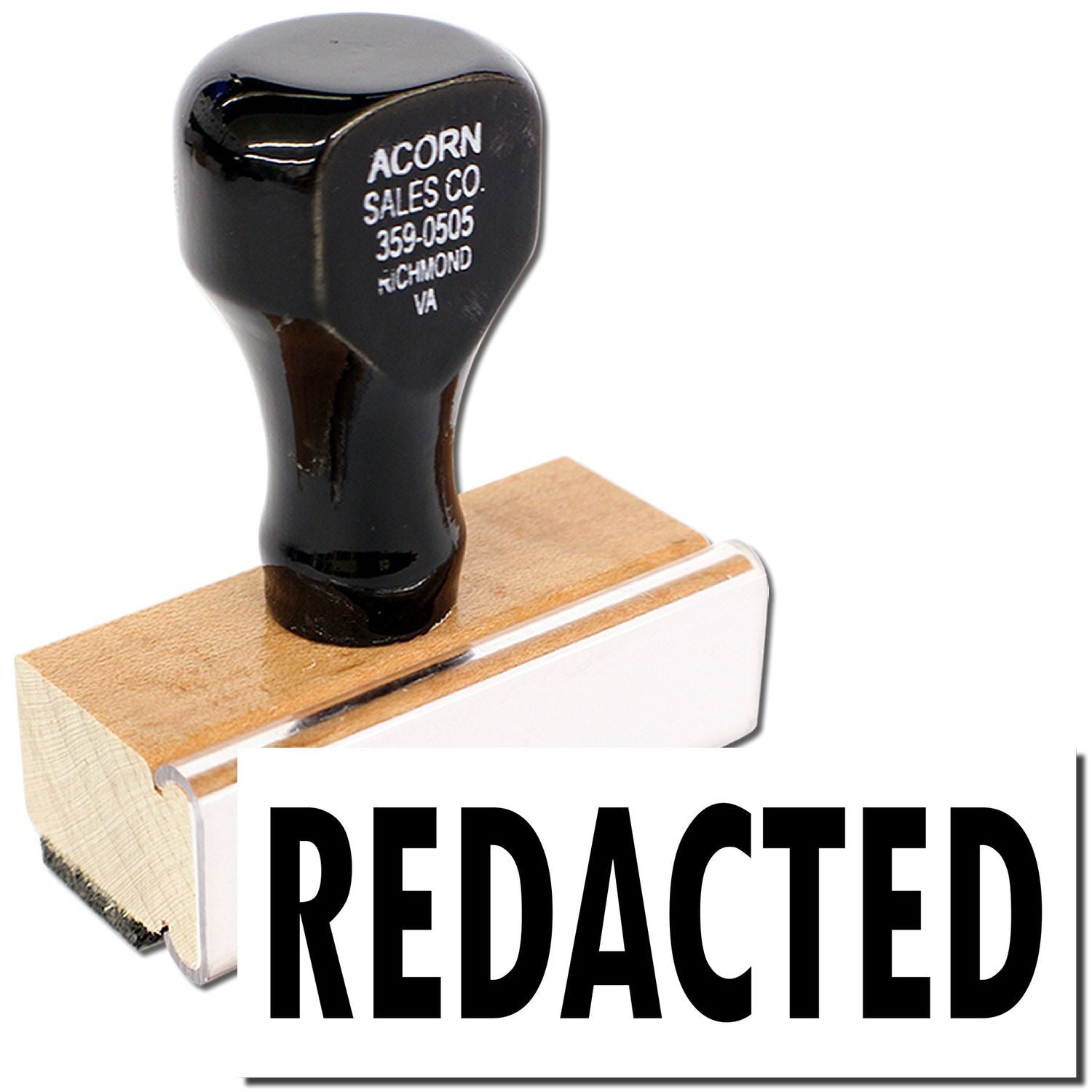 Black redacted rubber stamp with wooden handle and bold REDACTED text on white background.