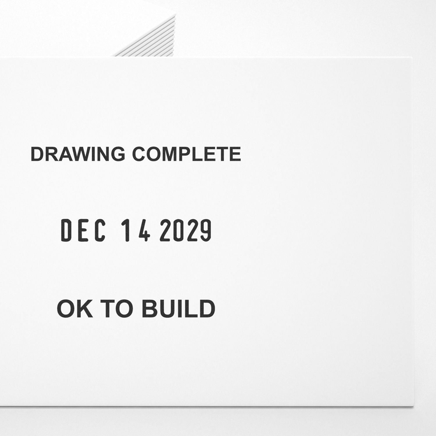 White architectural drawing cover stamped Drawing Complete Dec 14 2029 and OK to Build on a clean white document.