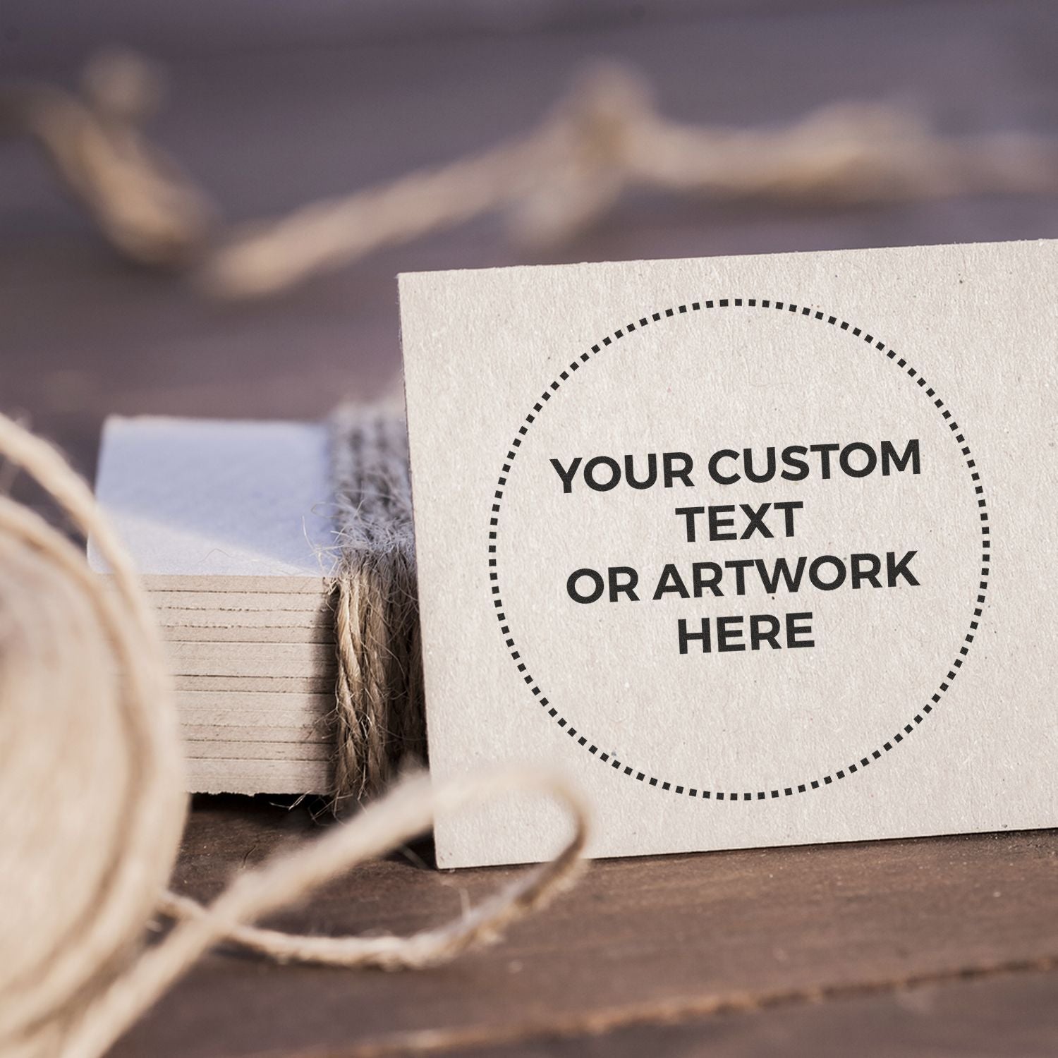 Custom text or artwork label mockup on white card with dashed circle, perfect for branding and message placement on wooden desk.