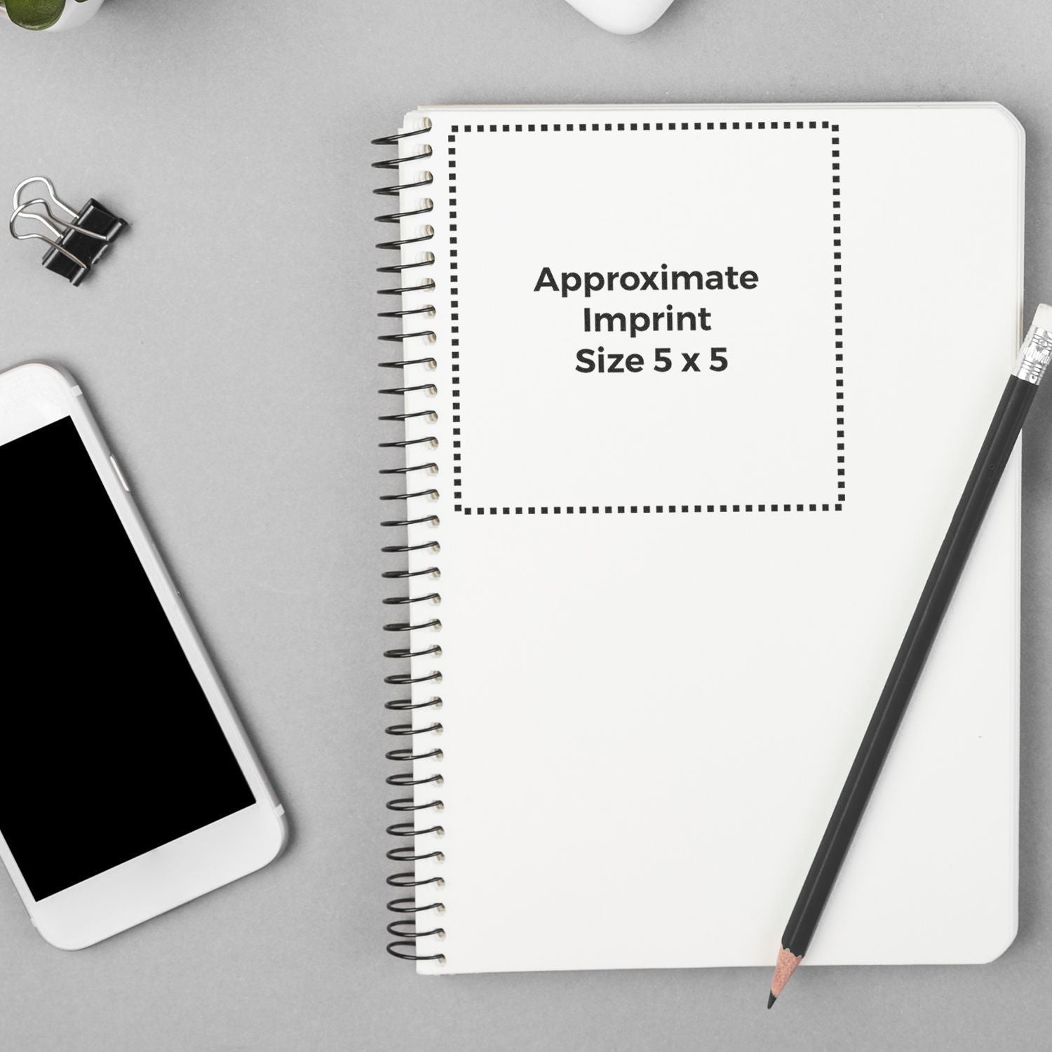 Top view notebook mockup showing approximate imprint size 5 x 5 for custom logo printing on stationery branding placement template