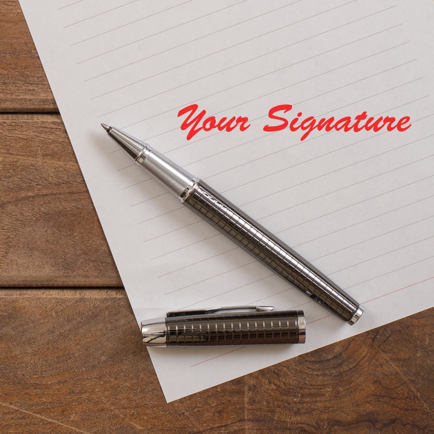 Silver pen on lined notebook paper with Your Signature text, business signing and contract concept.