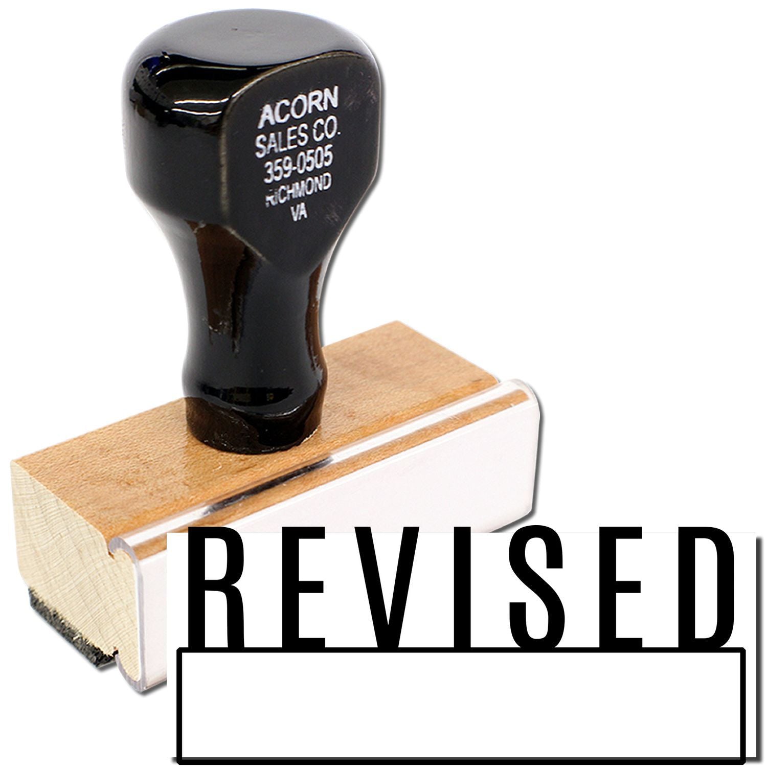 Revised rubber stamp with black handle and wood base on a white background.
